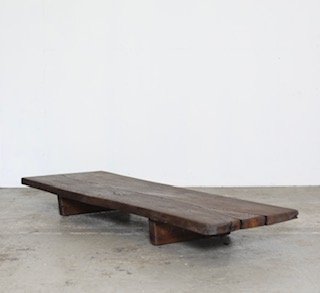 Rustic wooden coffee table on concrete floor