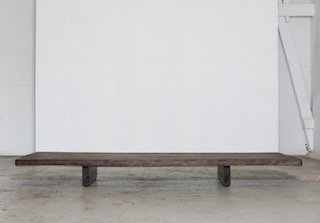 Minimalist wooden bench against white background
