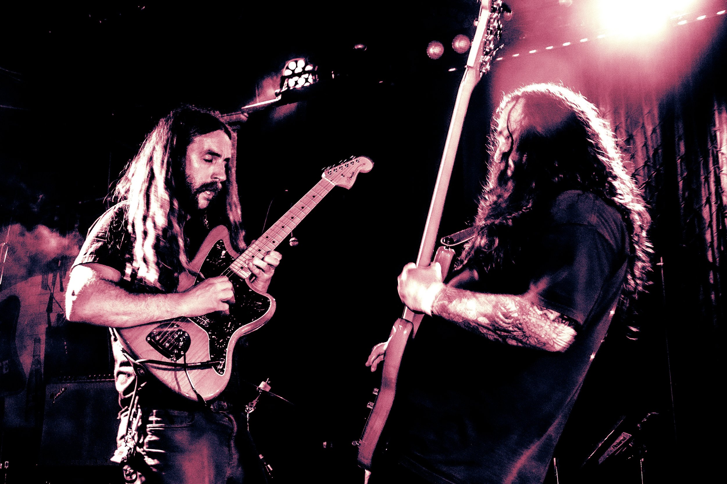 Liquid Pennies guitarist Chas Binns and Bassist Tysonious Mink play together at a live concert at Crowbar in Ybor City Florida.