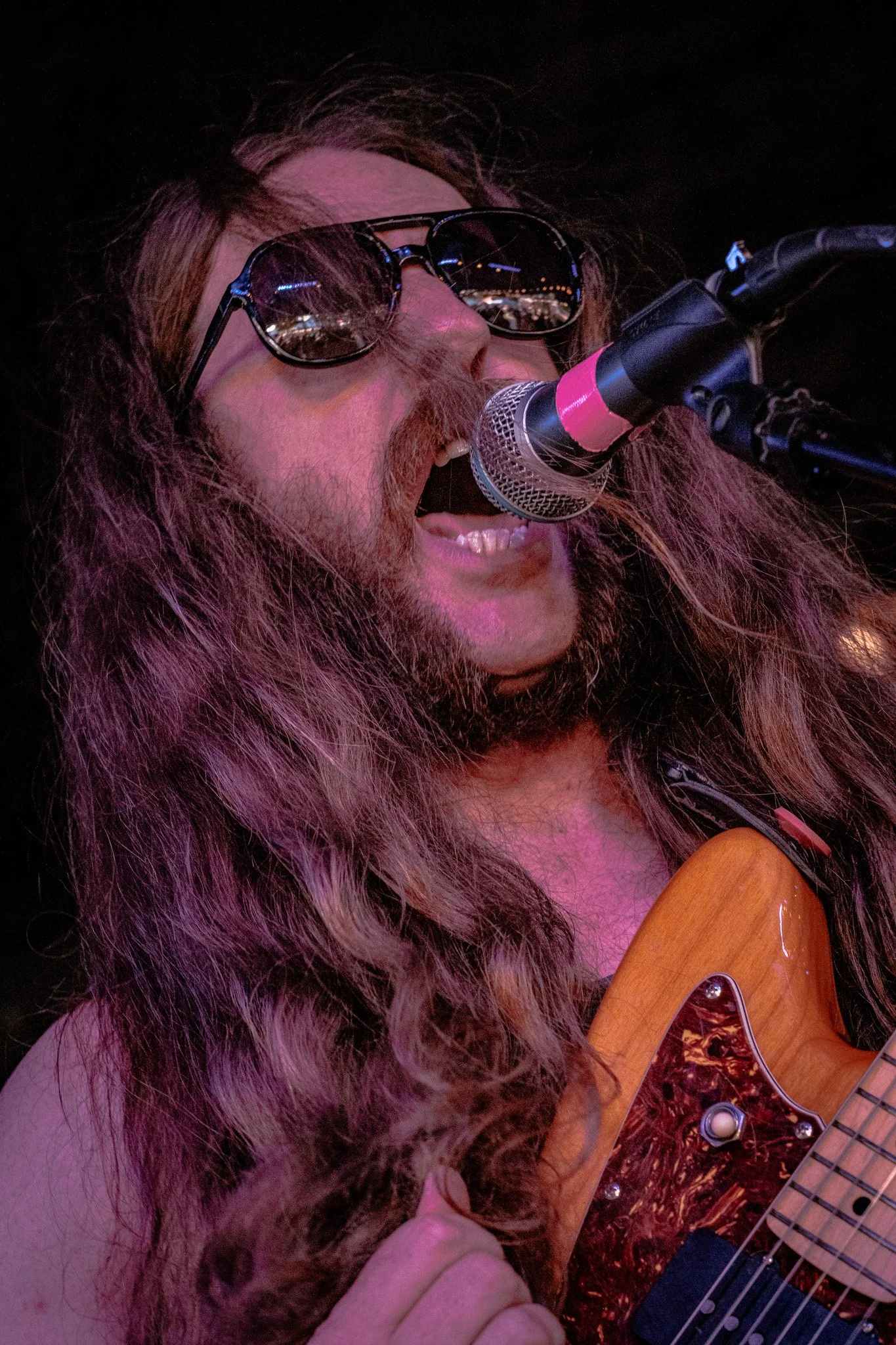 Chas Binns, singer and guitarist of rock band Liquid Pennies performing at Cage Bewing, a bar/music venue, in Saint Petersburg Florida. 
