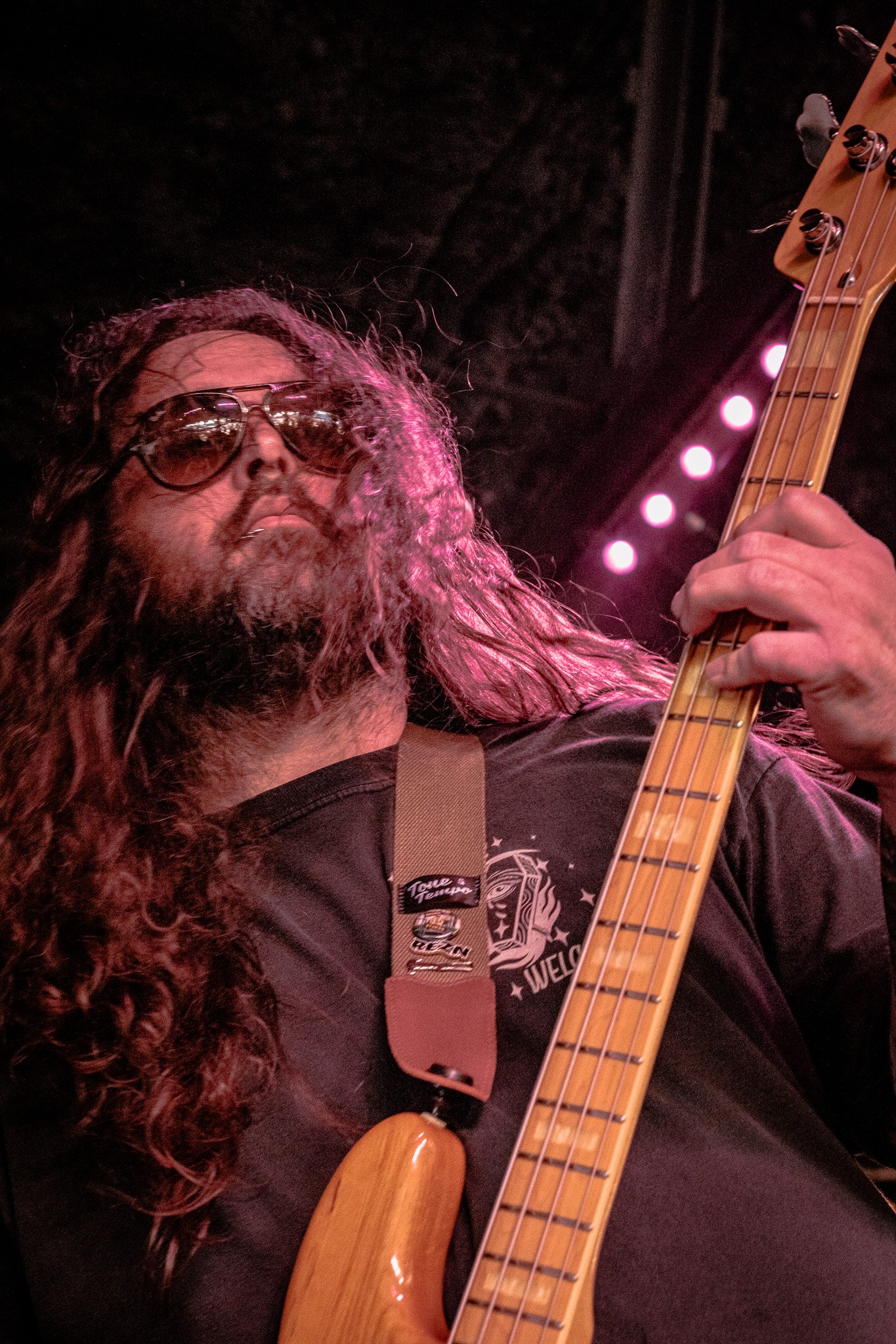 Liquid Pennies bassist Tysonious Mink performing at a live show.
