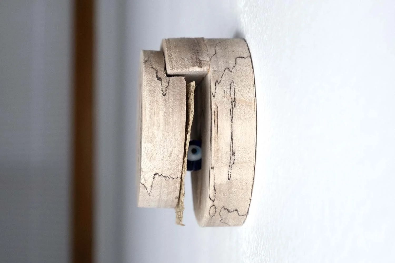 Wood, dandelion, and found an evil eye