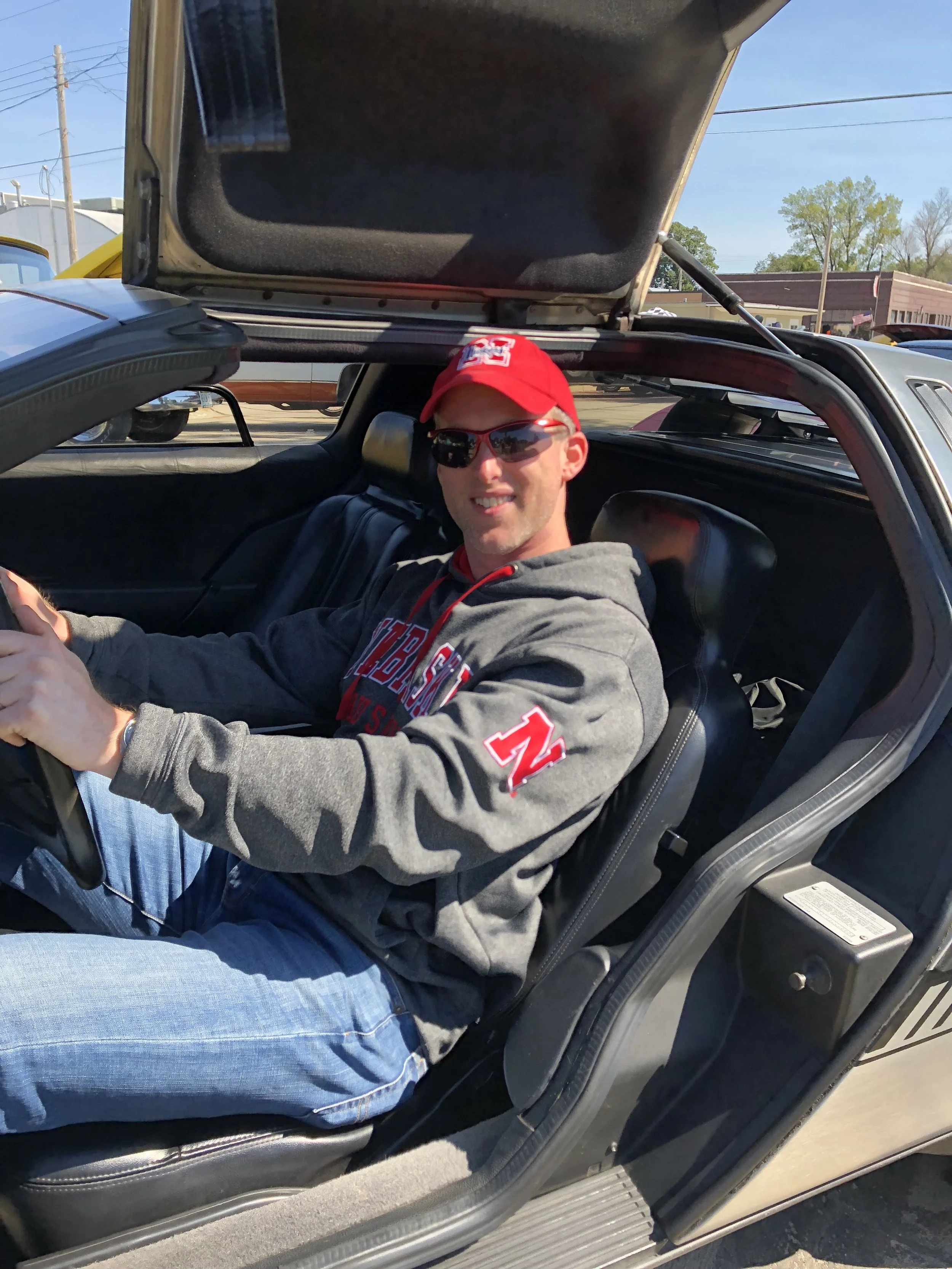 Author Robert M. Kennedy poses for a photo in the driver's seat of a 1981 DeLorean DMC-12.