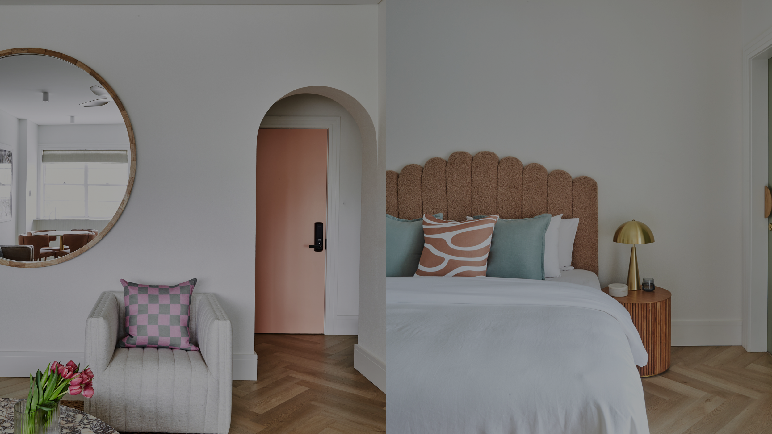 Interior view of a modern bedroom and living room with pastel colors, wooden furniture, and decorative pillows.