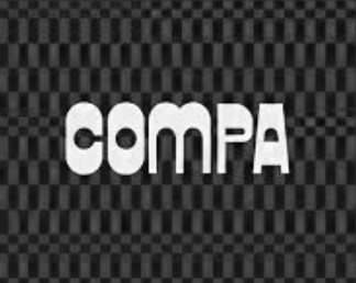 The word 'COMPA' in bold white letters on a dark checkered background.