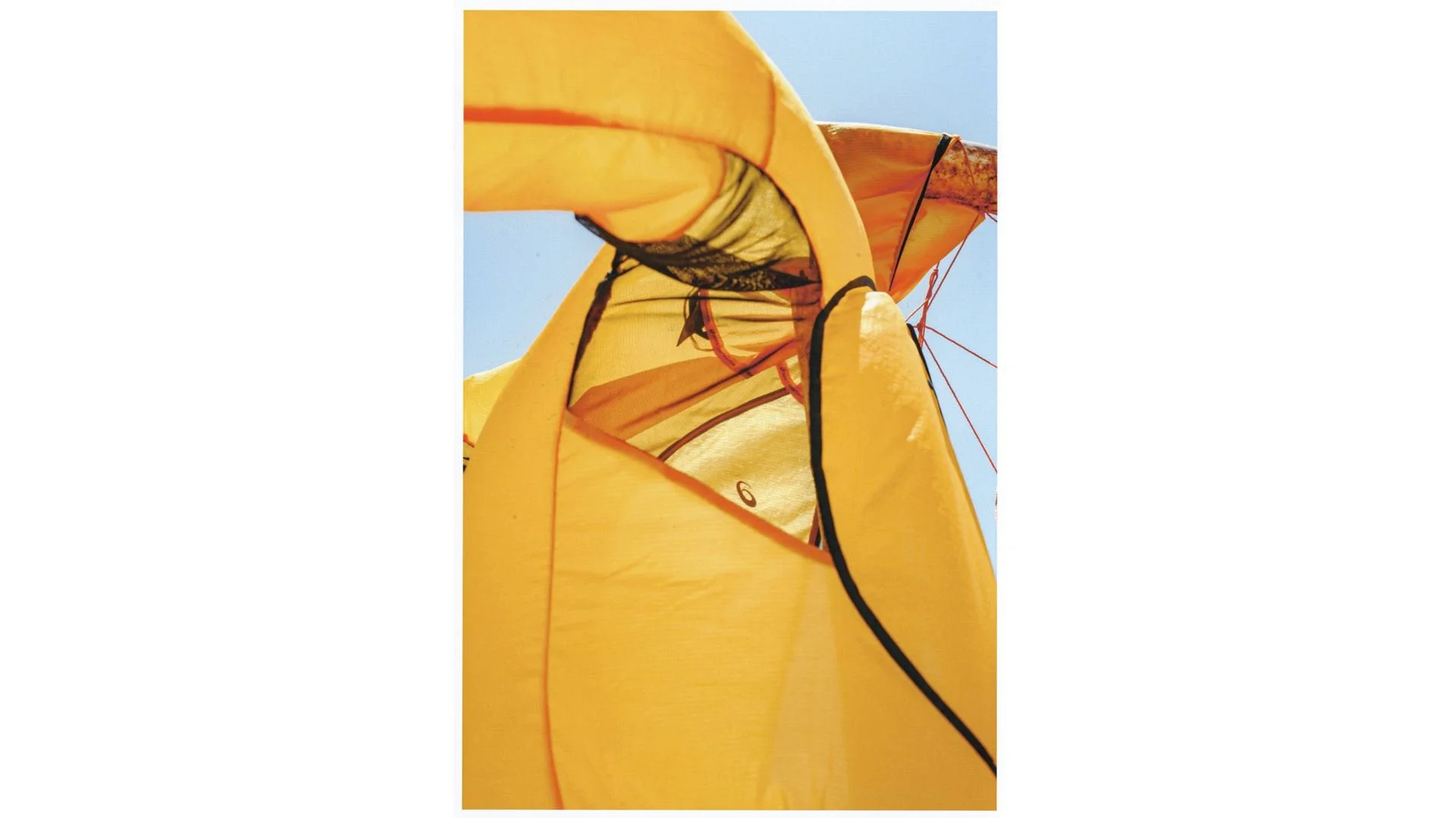 Close view of translucent yellow fabric and dark seam lines in ASICS × Distance campaign imagery.