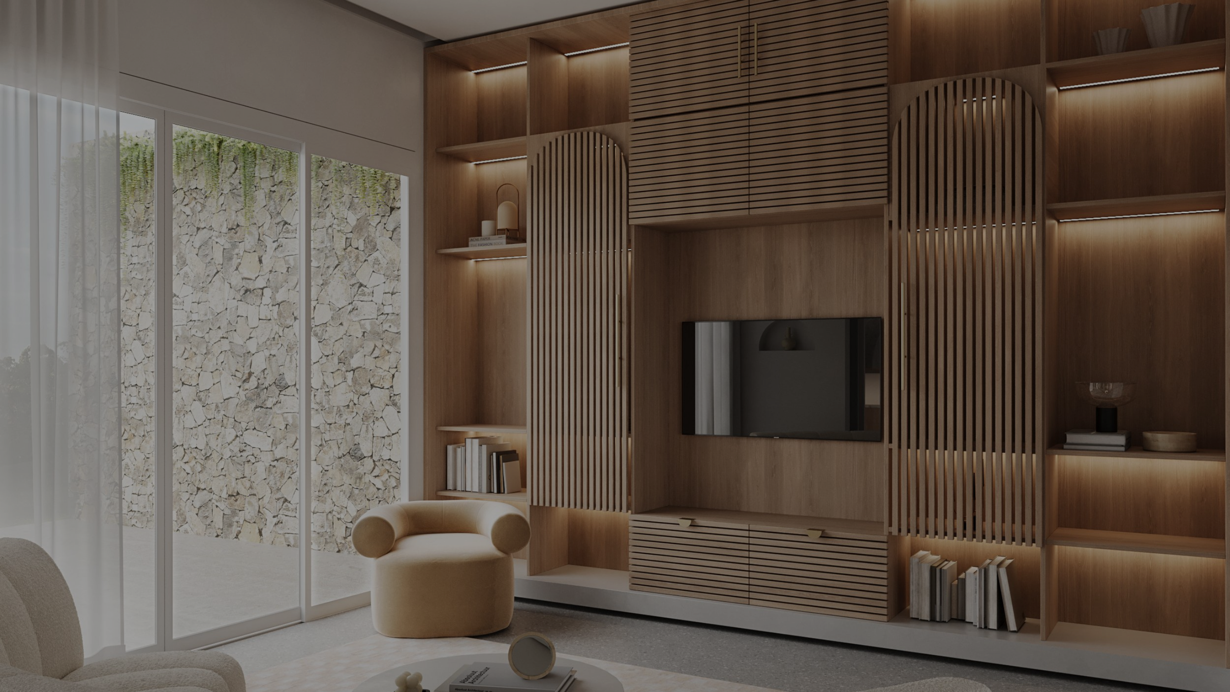 Modern living room with wooden built-in shelves, TV, cream armchair, and large glass sliding door with stone wall outside.