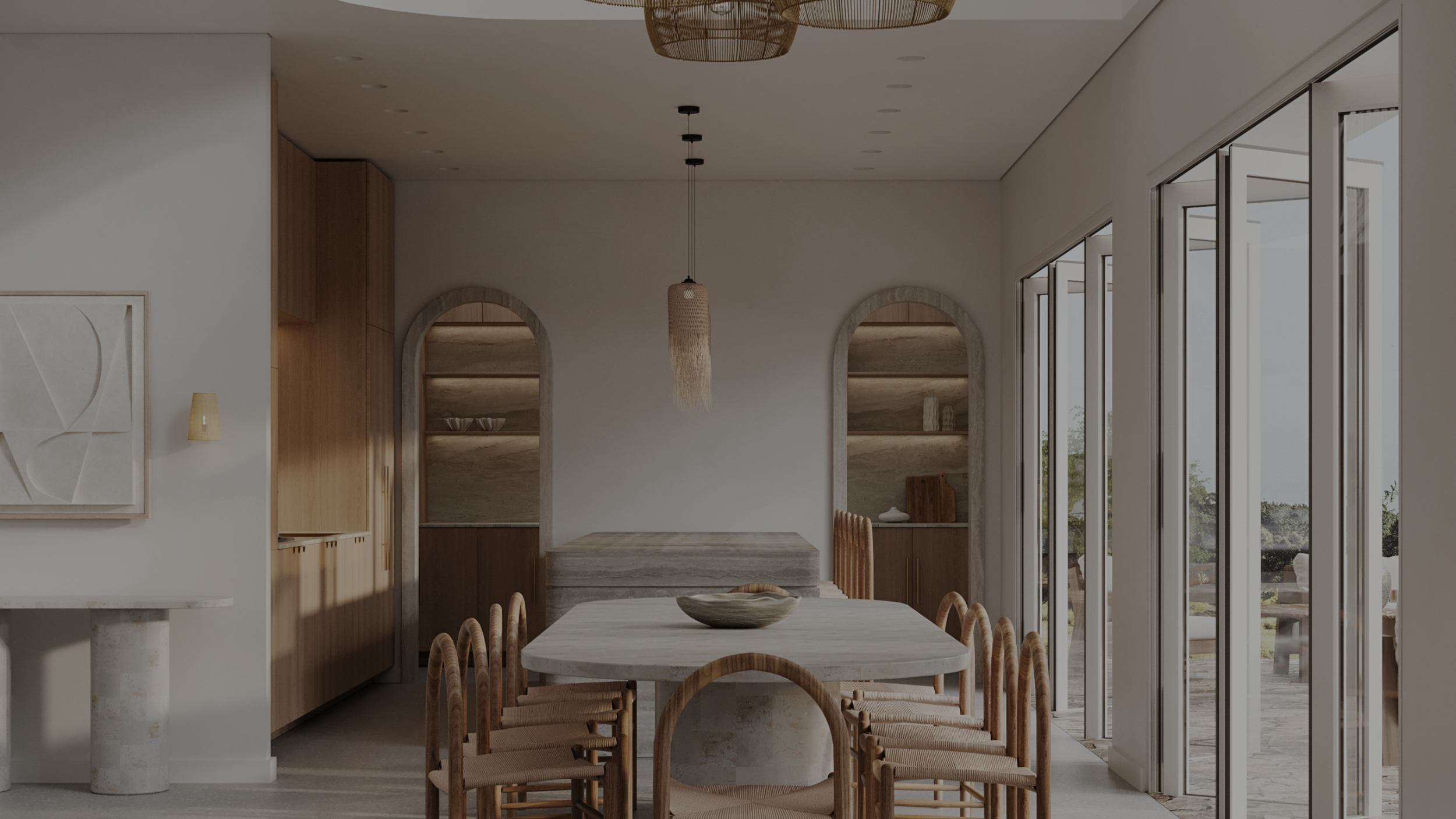 Minimalist dining room with a long oval table, wooden chairs, sliding glass doors leading to outdoor patio, wood and stone shelving, and neutral-colored decor.