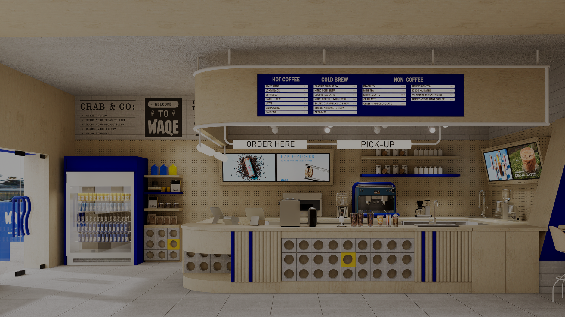 Coffee shop counter with a digital menu board displaying hot coffee, cold brew, and non-coffee drinks. The counter features order and pick-up signs, a refrigerator with bottled drinks, and various coffee-making equipment. Digital screens on the wall