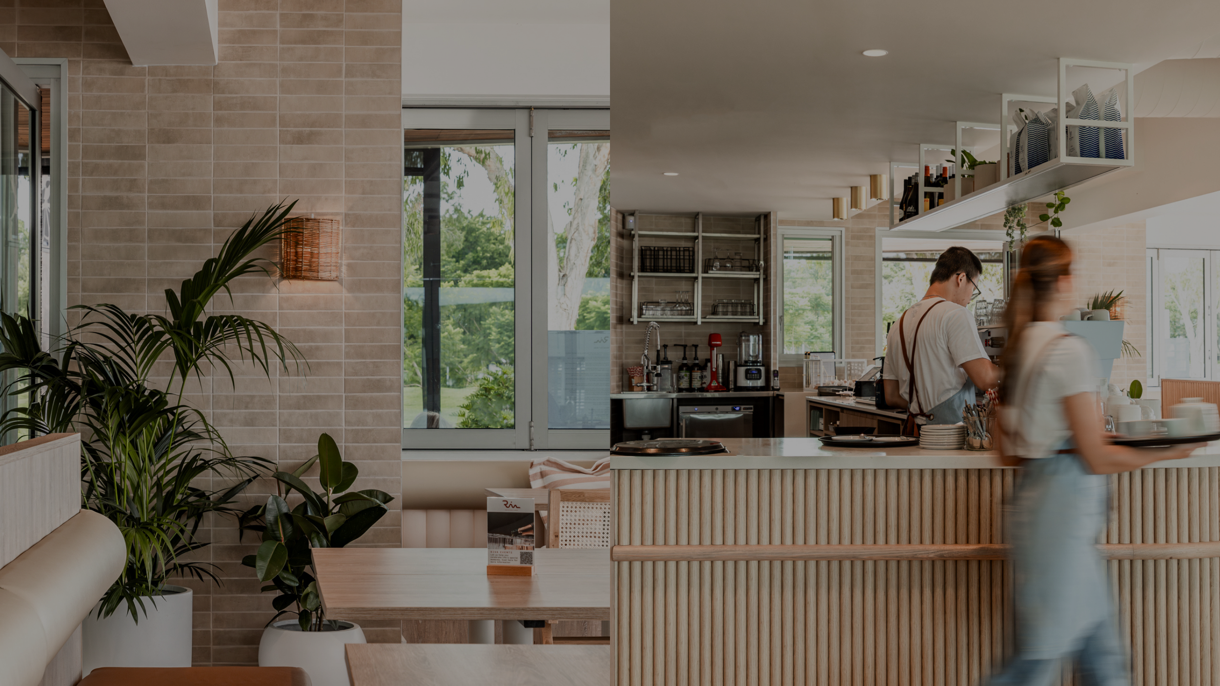 Empty dining area with potted plants and a large window on the left side of the image.