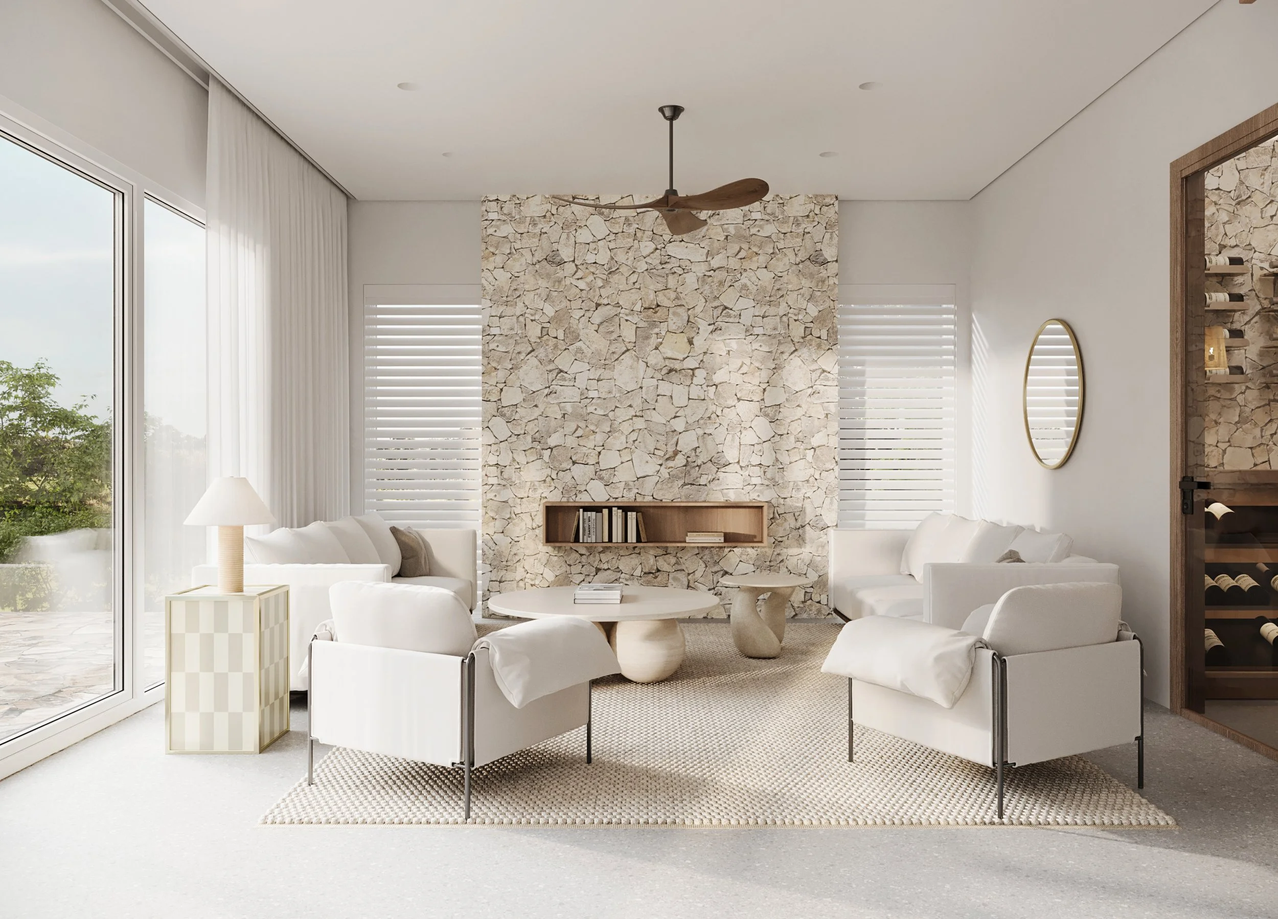 Modern living room with white furniture, stone accent wall, large windows, and a ceiling fan.