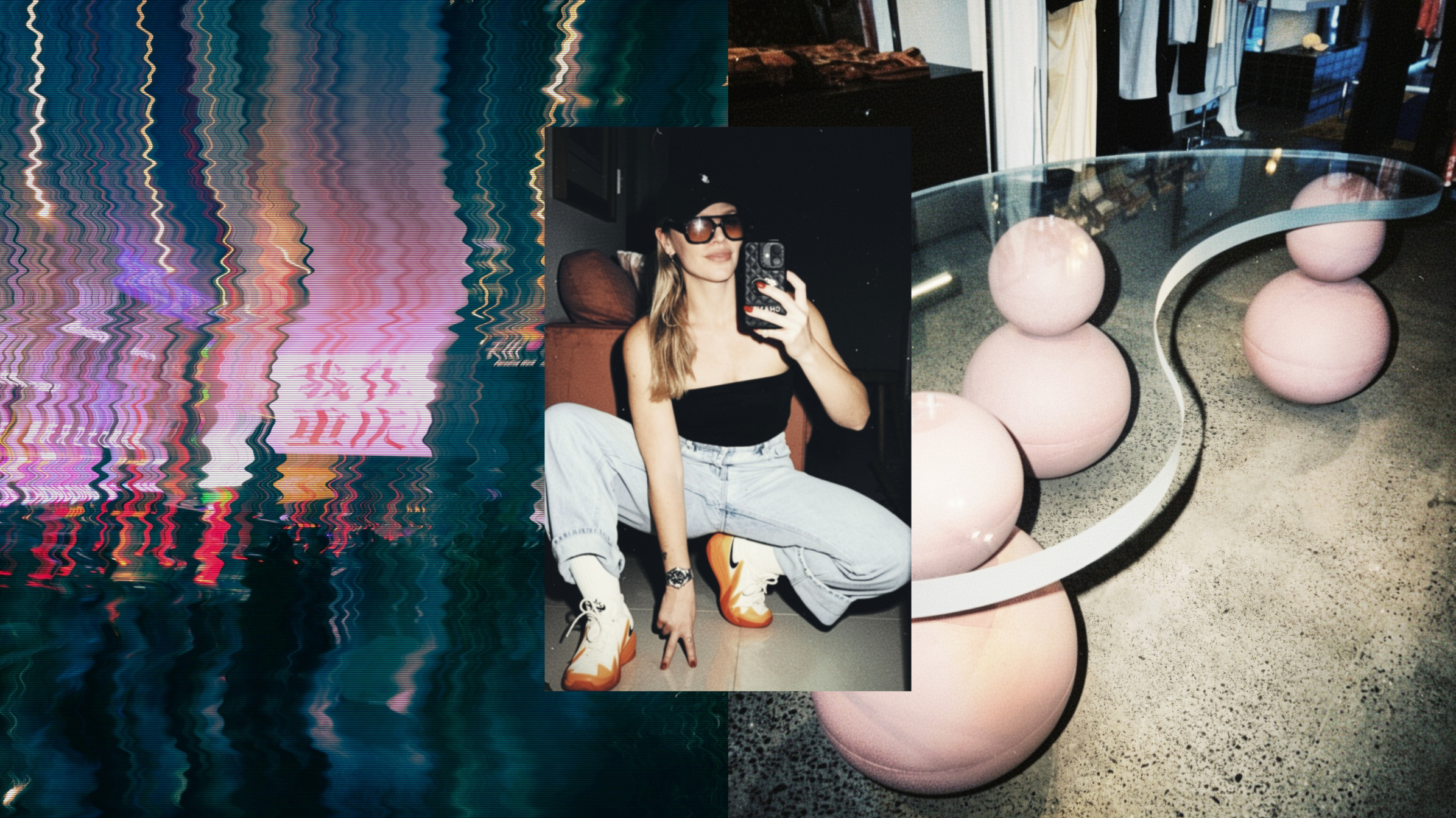 A woman taking a mirror selfie, wearing a black strapless top, light blue jeans, and orange and white sneakers. She is sitting on the floor in an indoor setting with modern furniture, including a curved glass and pink spherical chairs, and clothing displayed in the background.