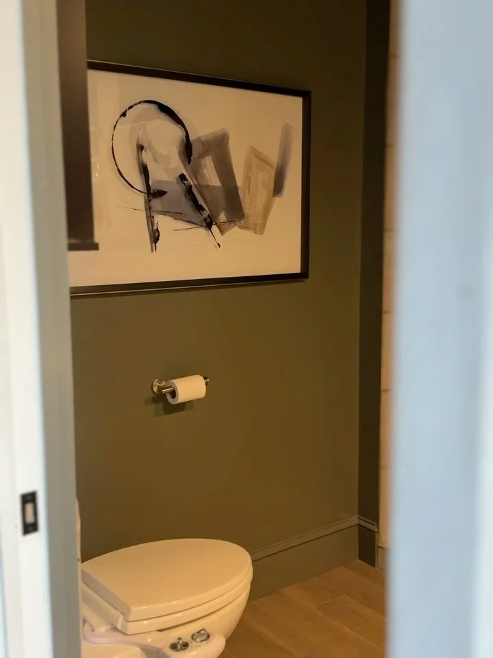 This bathroom got a full personality reset. We drenched the walls, ceiling and trim in the same paint color so the space would stop feeling busy and start feeling settled. New lighting changed the mood immediately, the new trim work gave it some subt