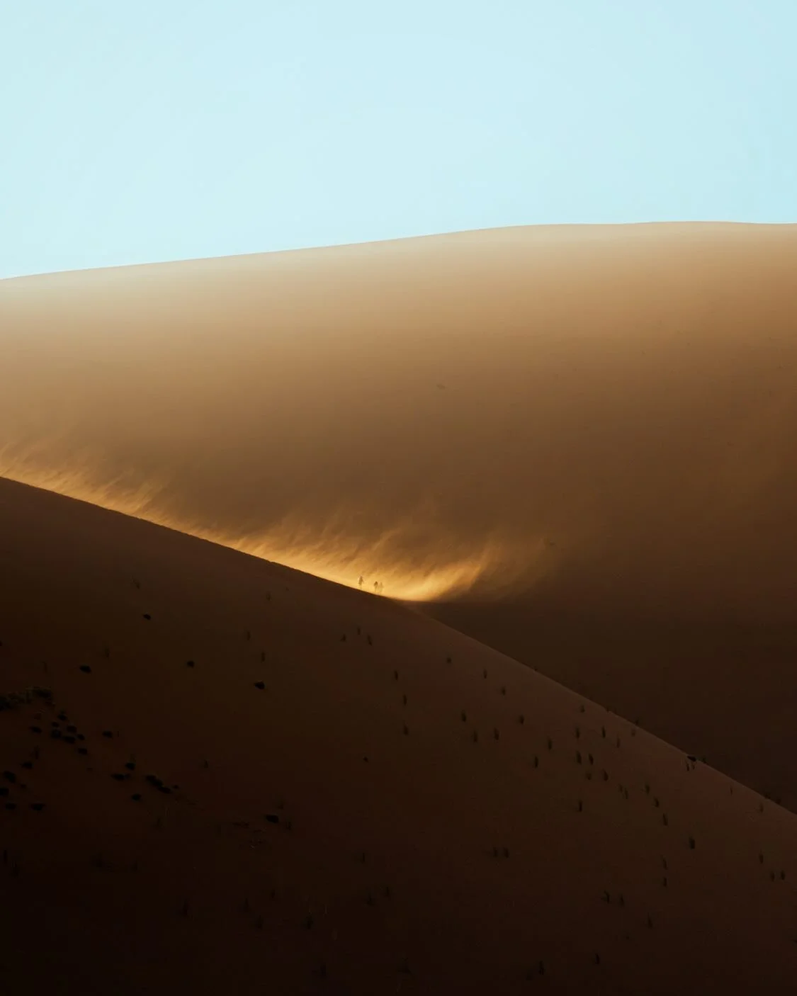 Sunrise over Namibian dunes ☀️

The morning sun was rising over Deadvlei as the wind carried away the sand atop the dune peaks. 

It&rsquo;s been a moment since I&rsquo;ve shared  some travel memories. I wanted to say hi 👋 and hope everyone is doing