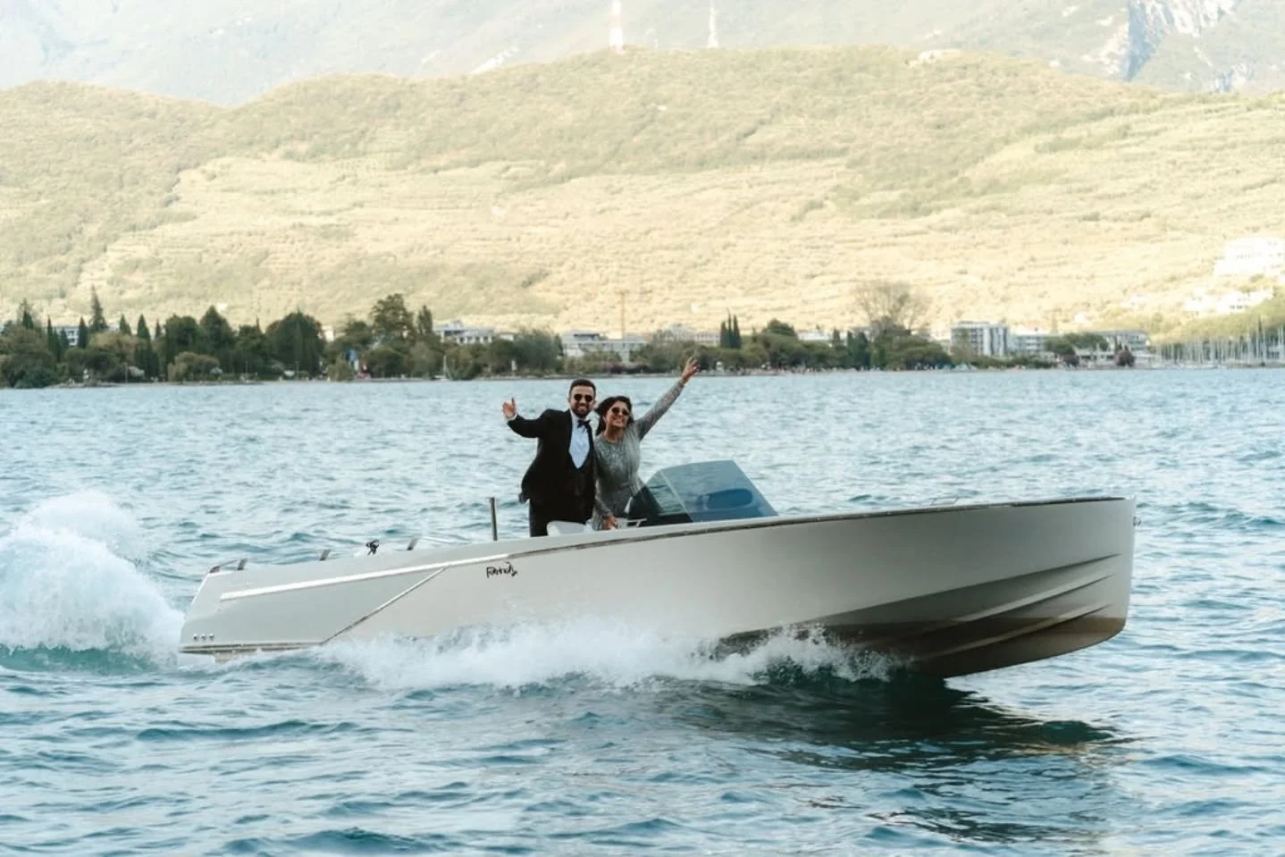 Arriving to their reception in style, surrounded by Lake Garda's sparkling waters. No grand announcement needed - the boat said it all...

@sitsb 
@ankitstagram 
@vallonefilms 
@Astoria_wedding 
@spiaggiaolivi
@thelondonrush
@francescomencucci.weddin