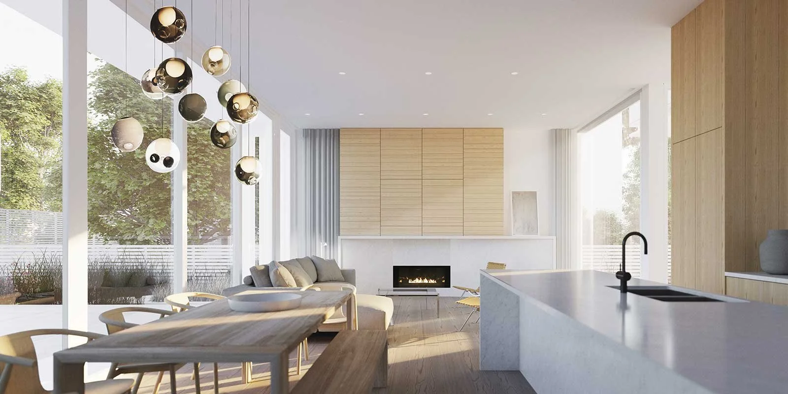 Modern open-concept living room and kitchen with large windows, light wood accents, a fireplace, and a cluster of hanging spherical pendant lights.