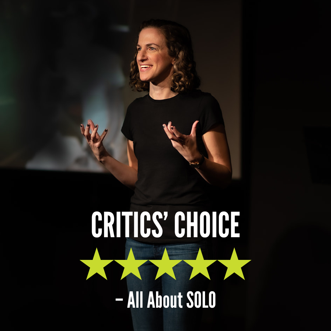 A woman speaking on stage in a black T-shirt. The text on the image reads 'CRITICS' CHOICE' with five green stars below and 'All About SOLO' underneath.