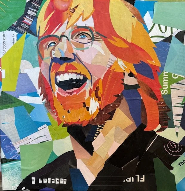 Colorful collage of a smiling man with red hair and glasses, created from various paper cutouts.