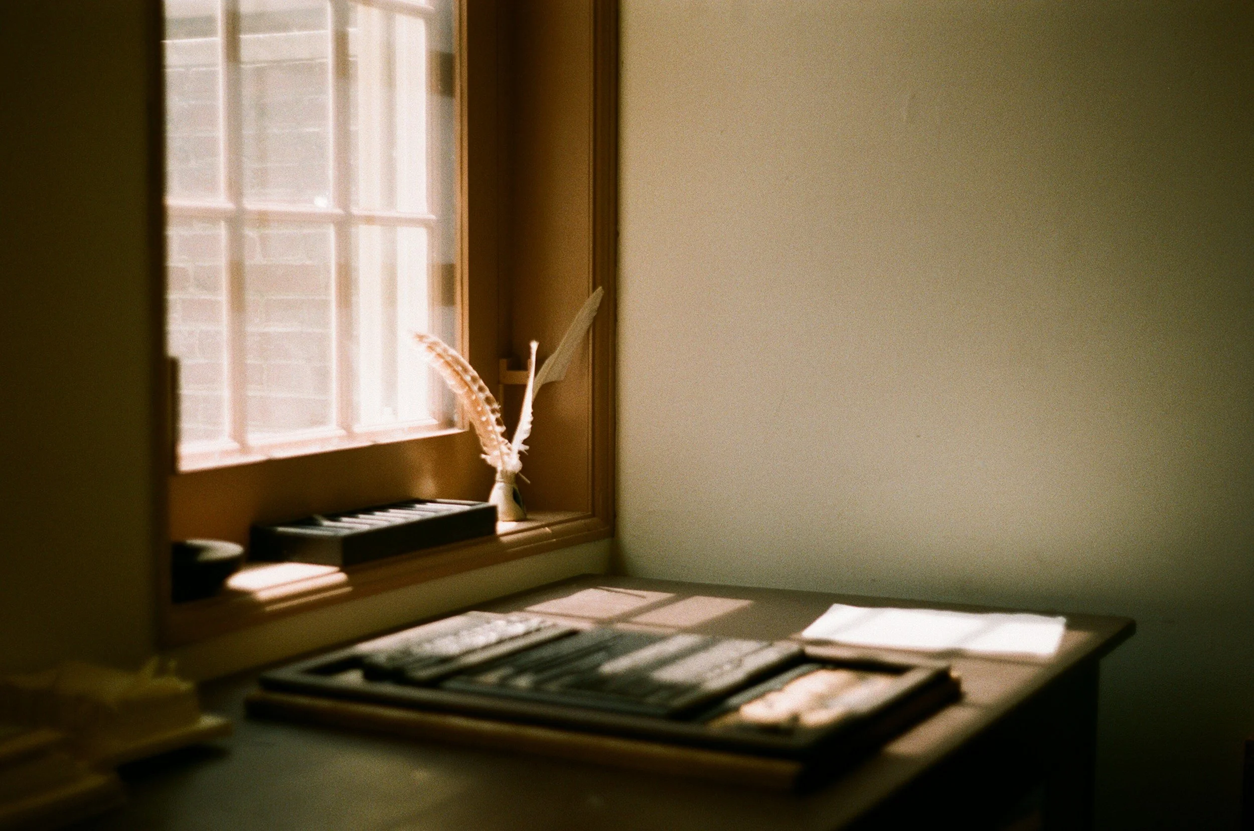 A desk by a window representing narrative and proof storytelling in impact reporting.