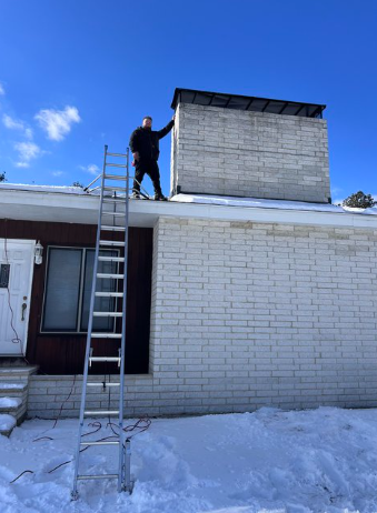 professional chimney sweeper and founder of Granite State Chimney standing aside a chimney after professional chimney sweeping in Auburn, NH