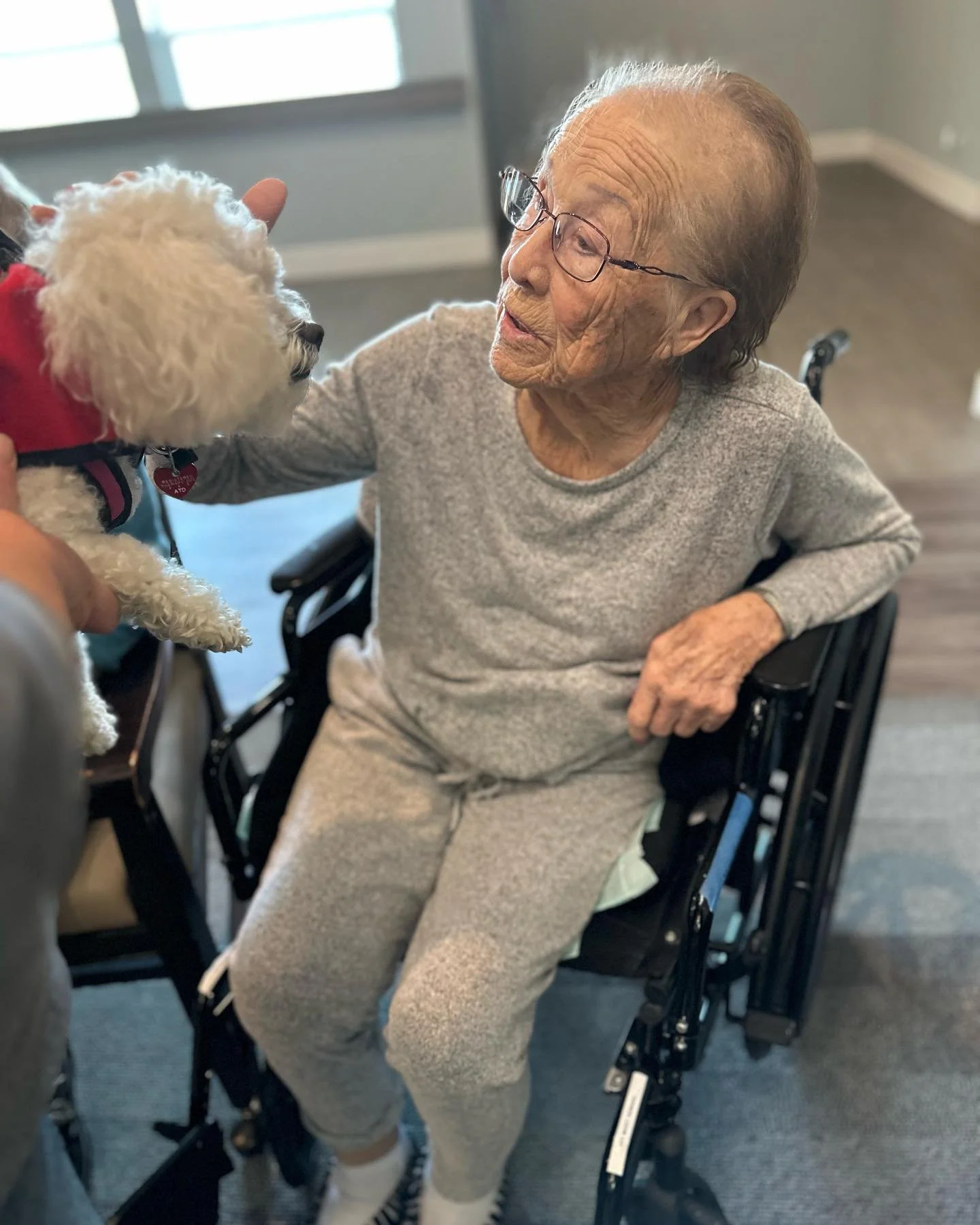Caregiver assisting an older adult in a supportive residential setting Caregiver assisting an older adult in a supportive residential setting