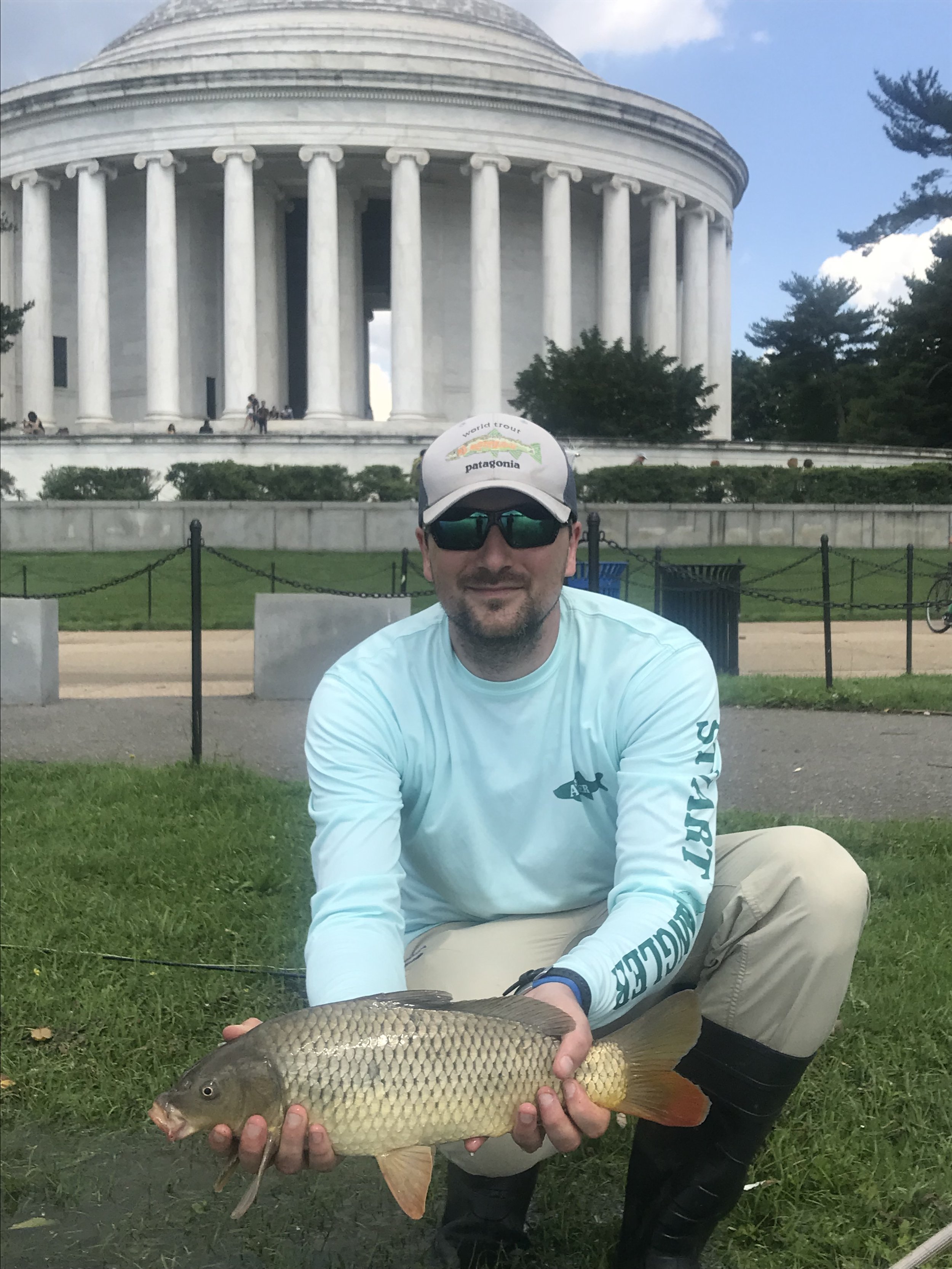 Thomas with a fly caught carp in front of the Jefferson memorial  Washington, D.C.