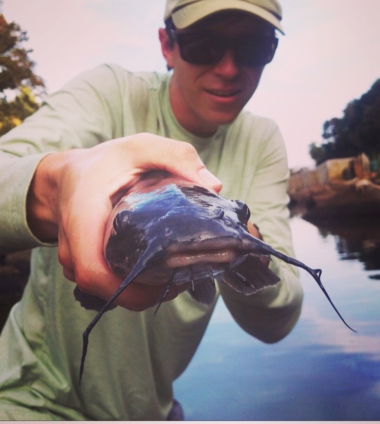 Misha with a catfish