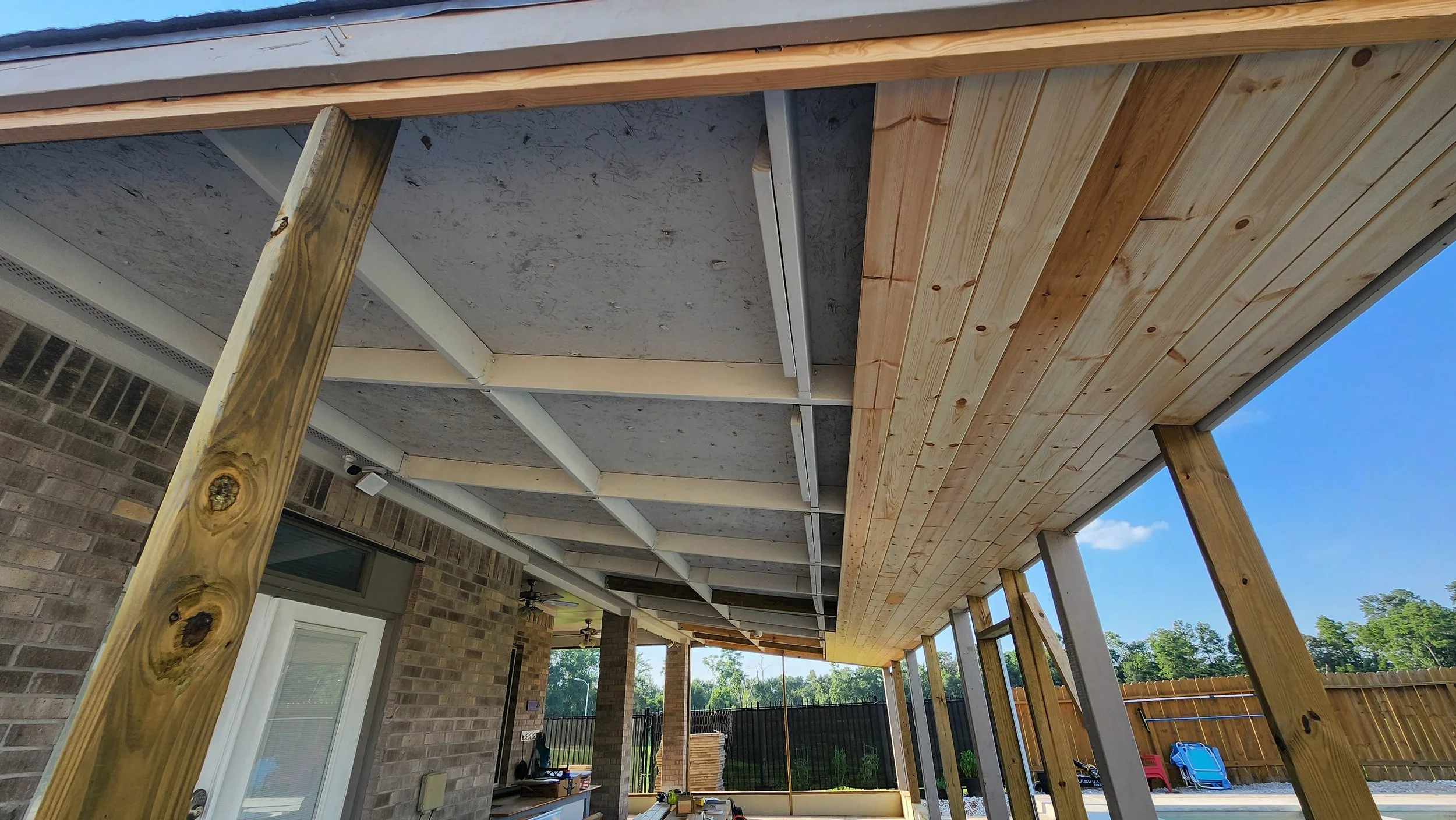 Rafters replaced. 1x6 slat ceiling installed and stained/sealed espresso