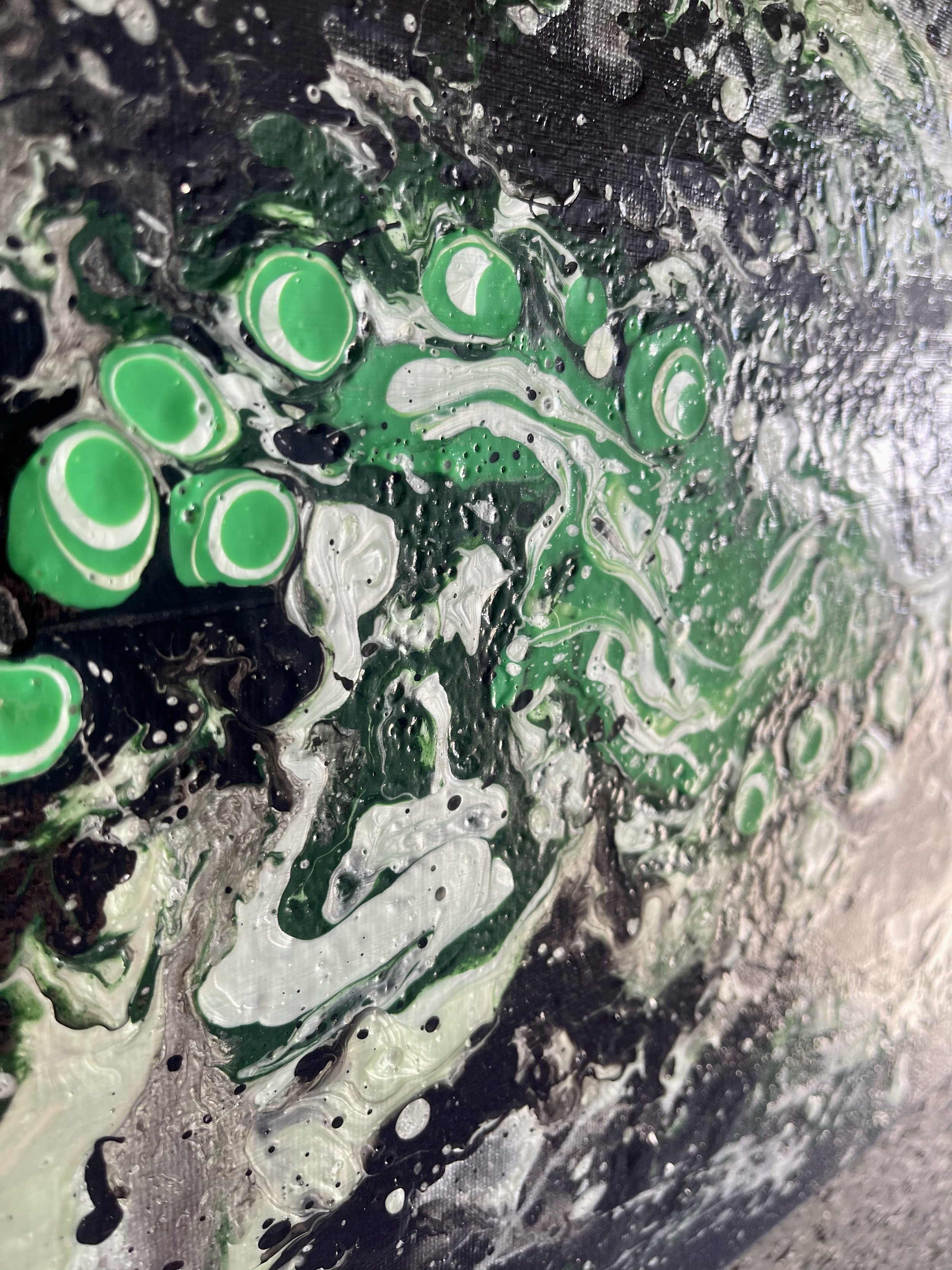 Muted black, dark and metallic mint greens are spearheaded by a powerful presence of lime green and white in Demagogue.