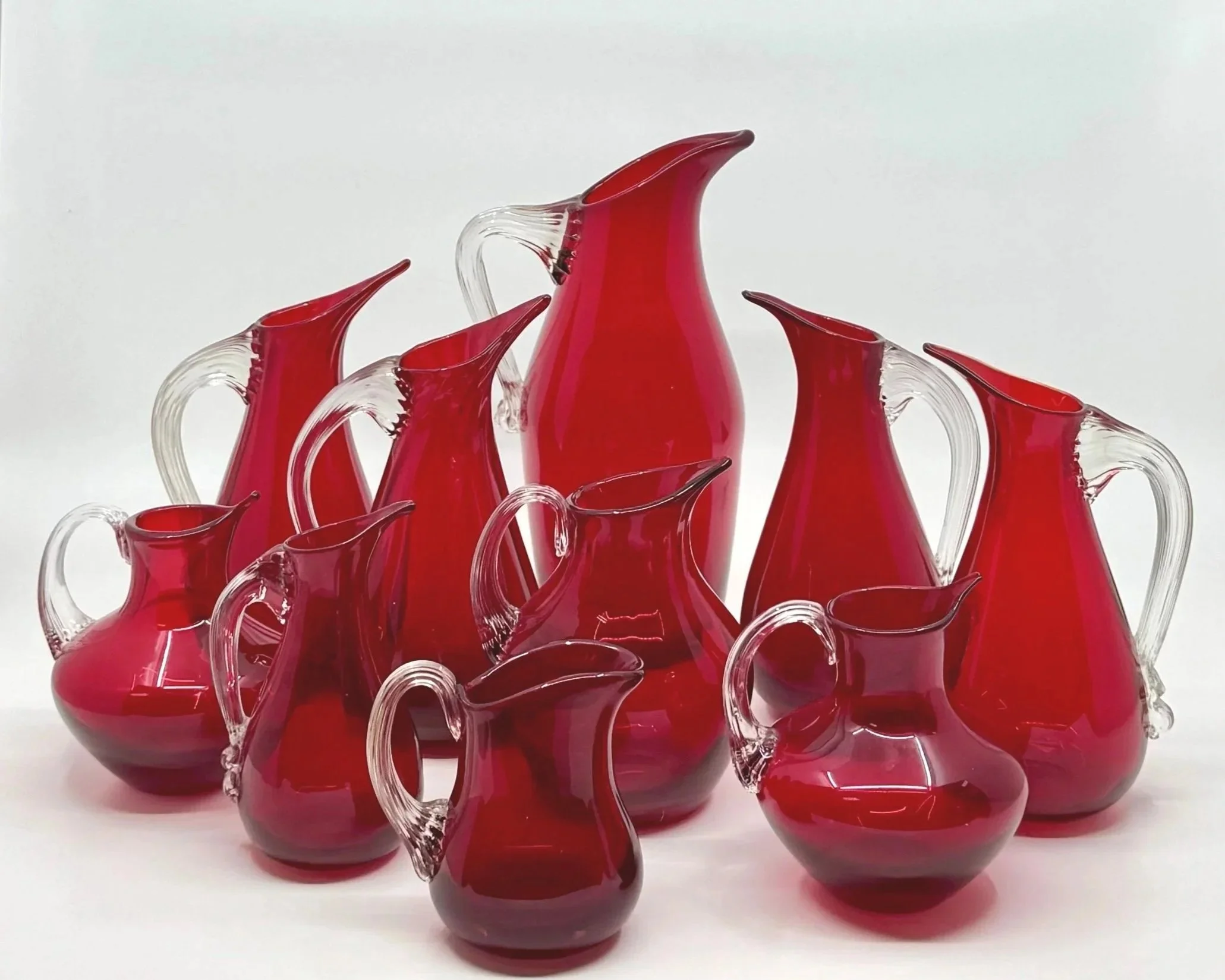 A Collection of Ruby Red Whitefriars Jugs