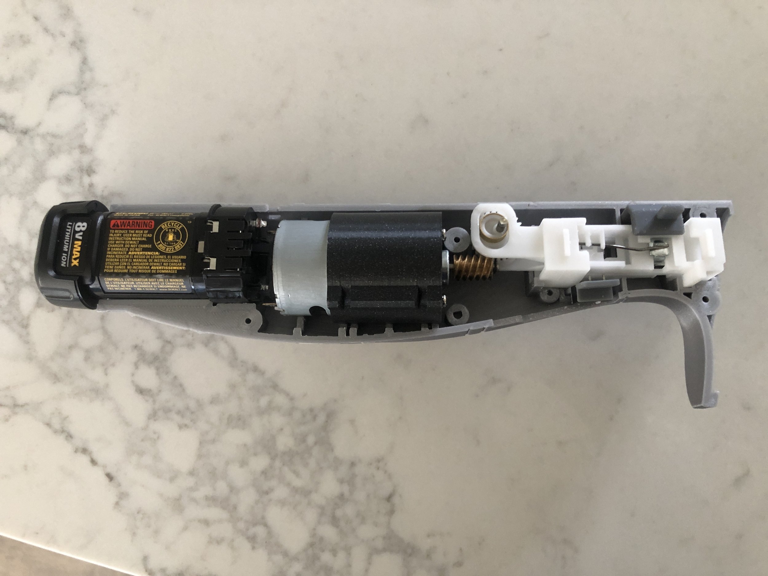 As I mentioned earlier, I choose to make as close to functional prototypes as I can. Shown above is the almost finalized 3D printed shell holding all of the old knife components as well as Dewalt components from a broken screwdriver that I bought on