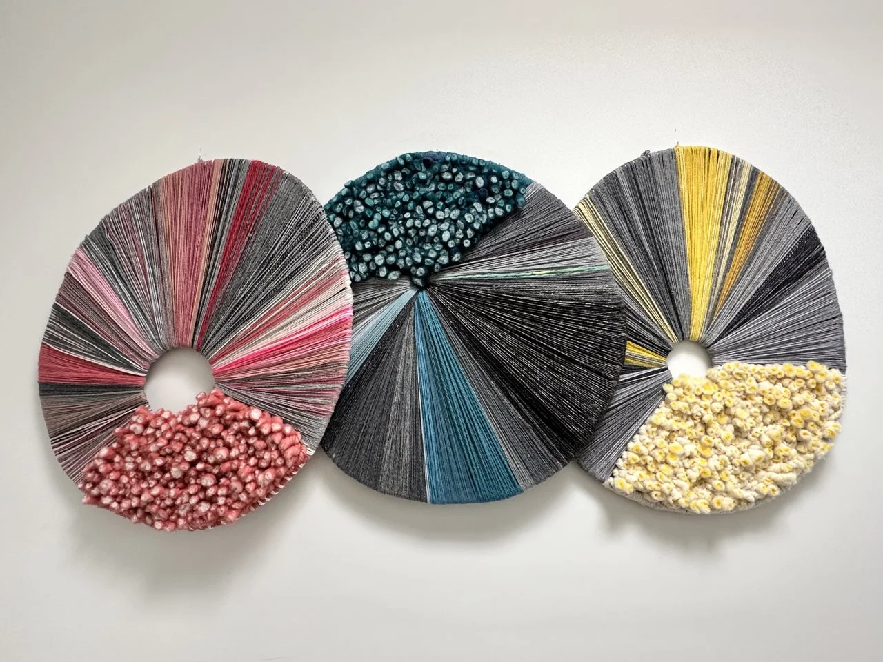 picture of round handwoven wallpiece wool and cotton modern weaving