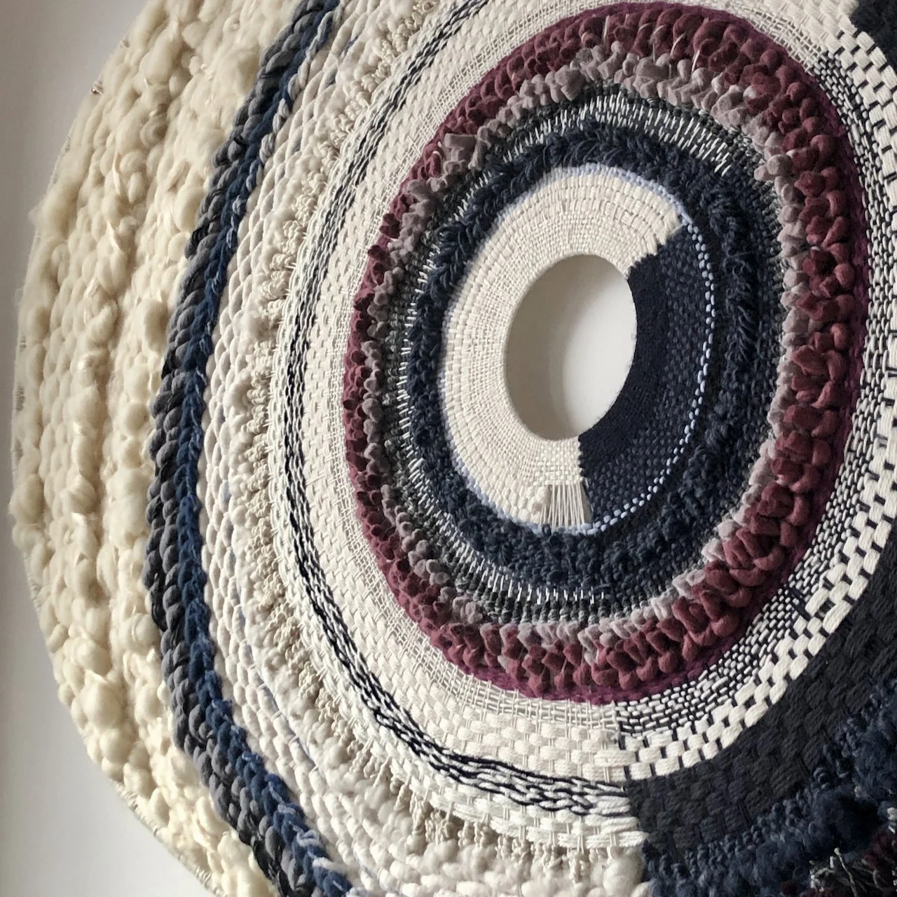 picture of round handwoven wallart wallpiece wallhanging wool and cotton modern weaving