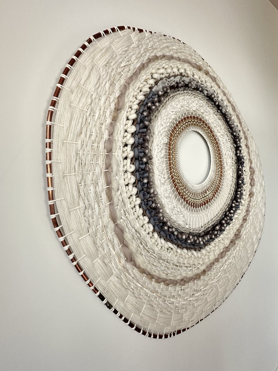 picture of round handwoven wallart wallpiece wallhanging wool and cotton modern weaving