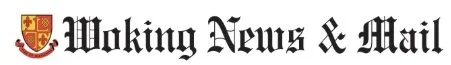 The logo of 'Woking News & Mail', featuring a shield with a red and gold crest.