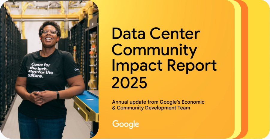 A smiling woman in a Google T-shirt standing in a data center with server racks and yellow piping.