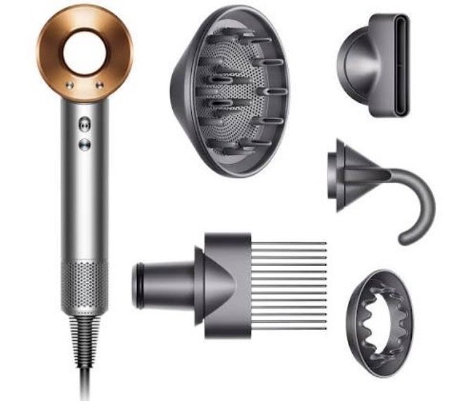 Disassembled Dyson Supersonic hair dryer with various internal components and attachments.