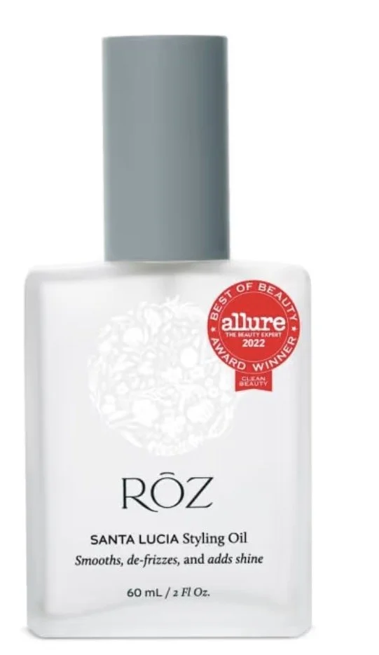 A white bottle of RŌZ Santa Lucia Styling Oil with a grey cap, featuring an Allure award badge from 2022.