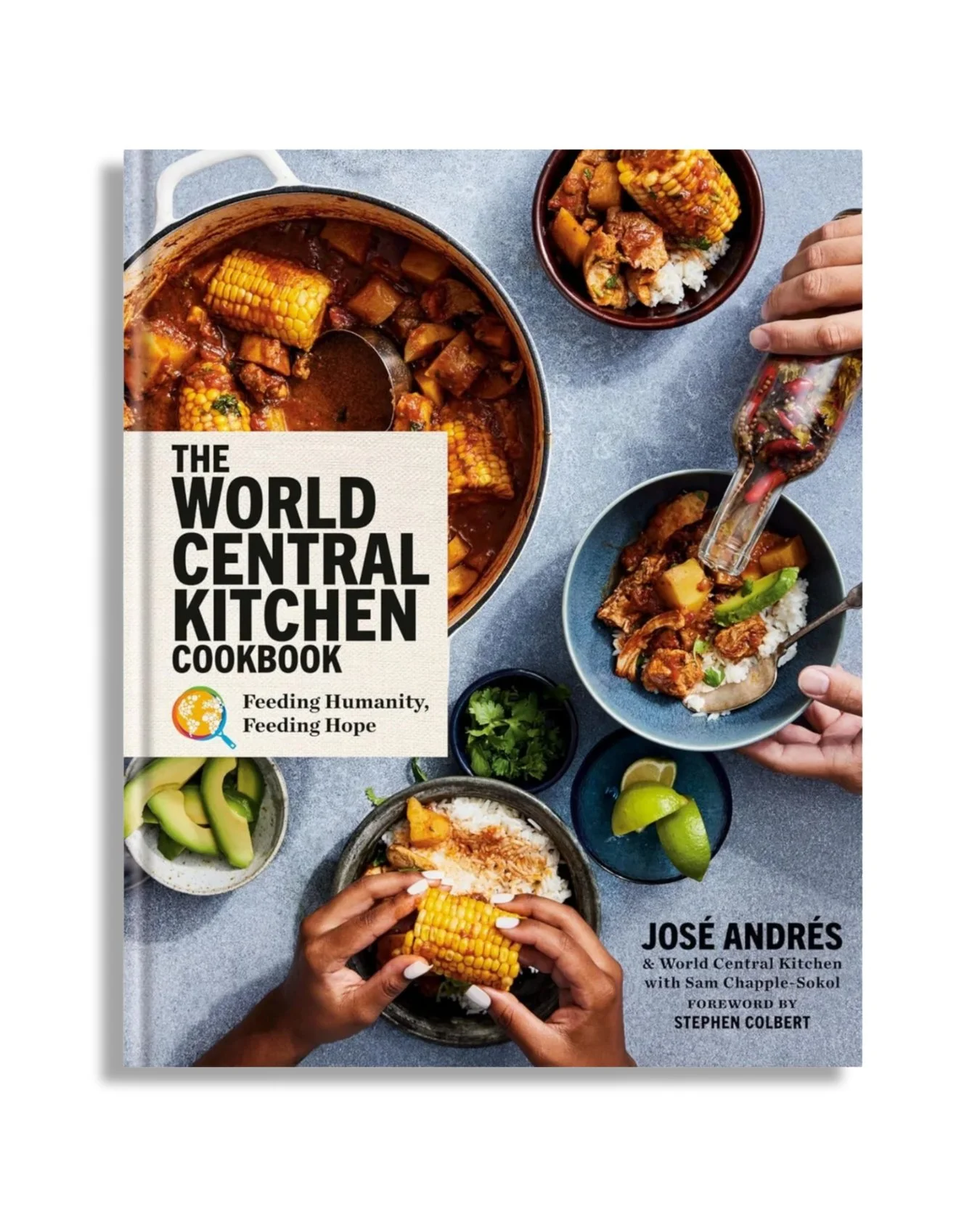 Cover of the book titled 'The World Central Kitchen Cookbook' by José Andrés, featuring a top-down view of diverse dishes with hands serving rice and corn dishes, and various ingredients on a gray surface.