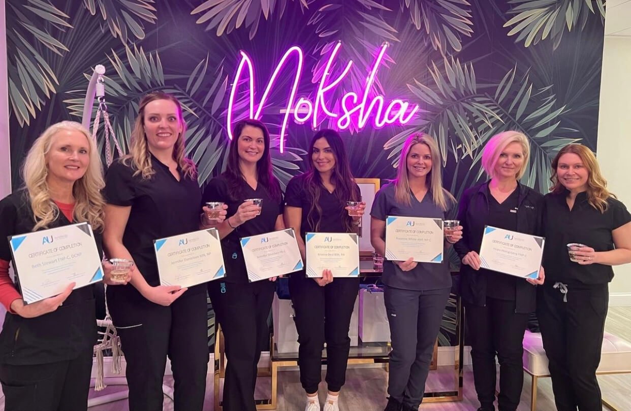 Jennifer Sturcken PA-C with her professional training certificate – Showcasing her expertise in medspa treatments.