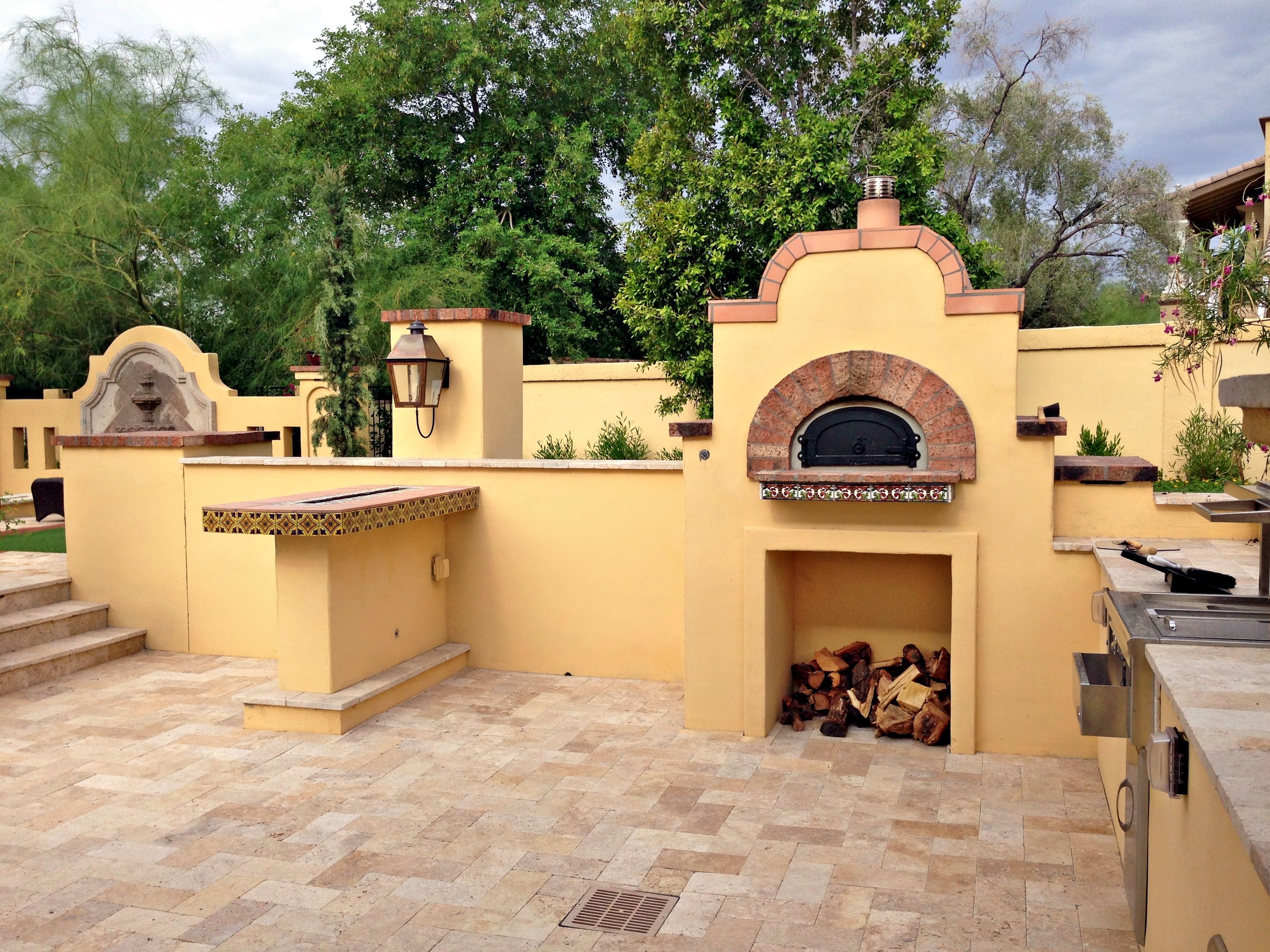 outdoor pizza oven tuscan spanish dining area patterned tiles