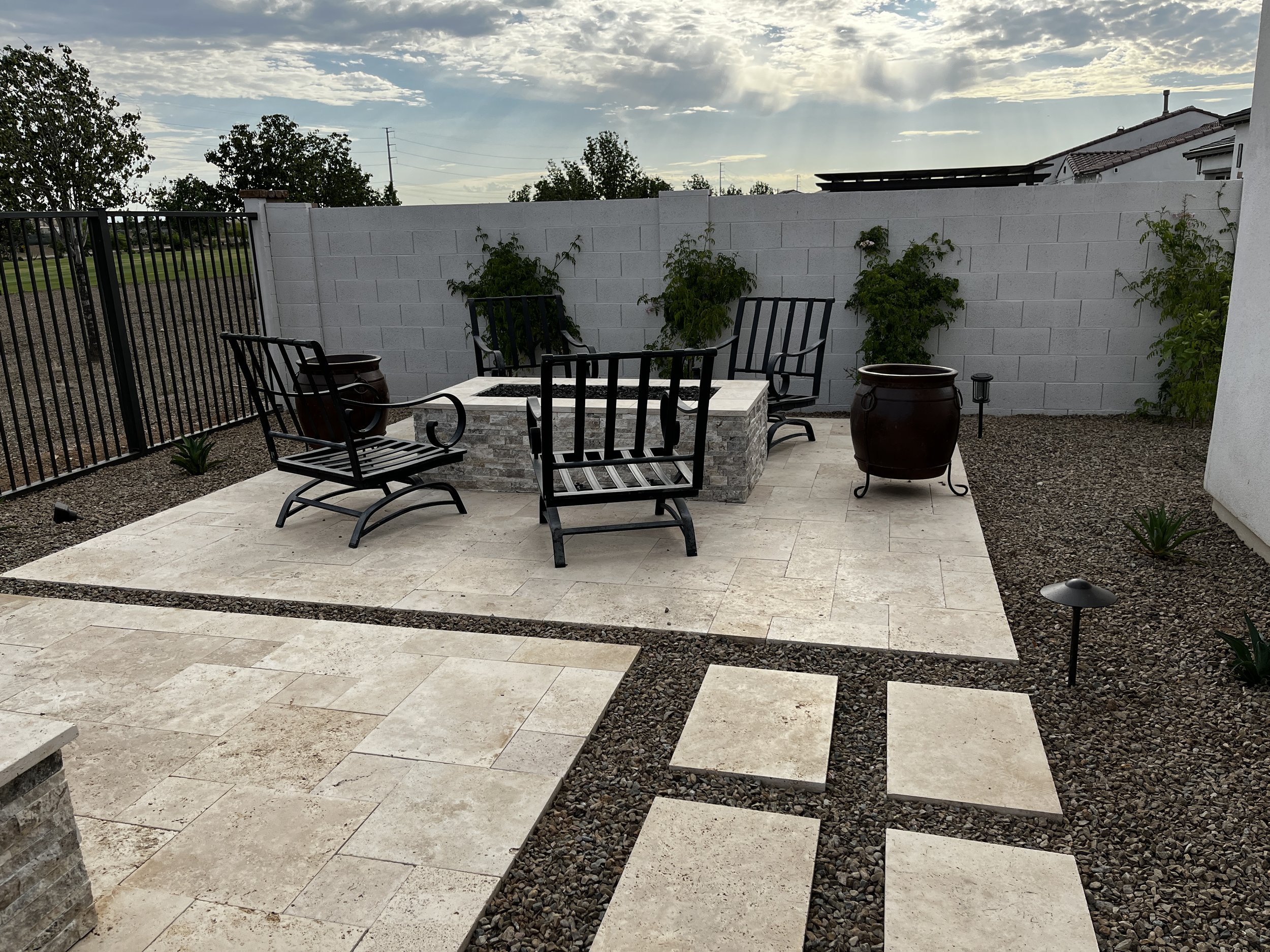 rectangular firepit stack stone seating area backyard