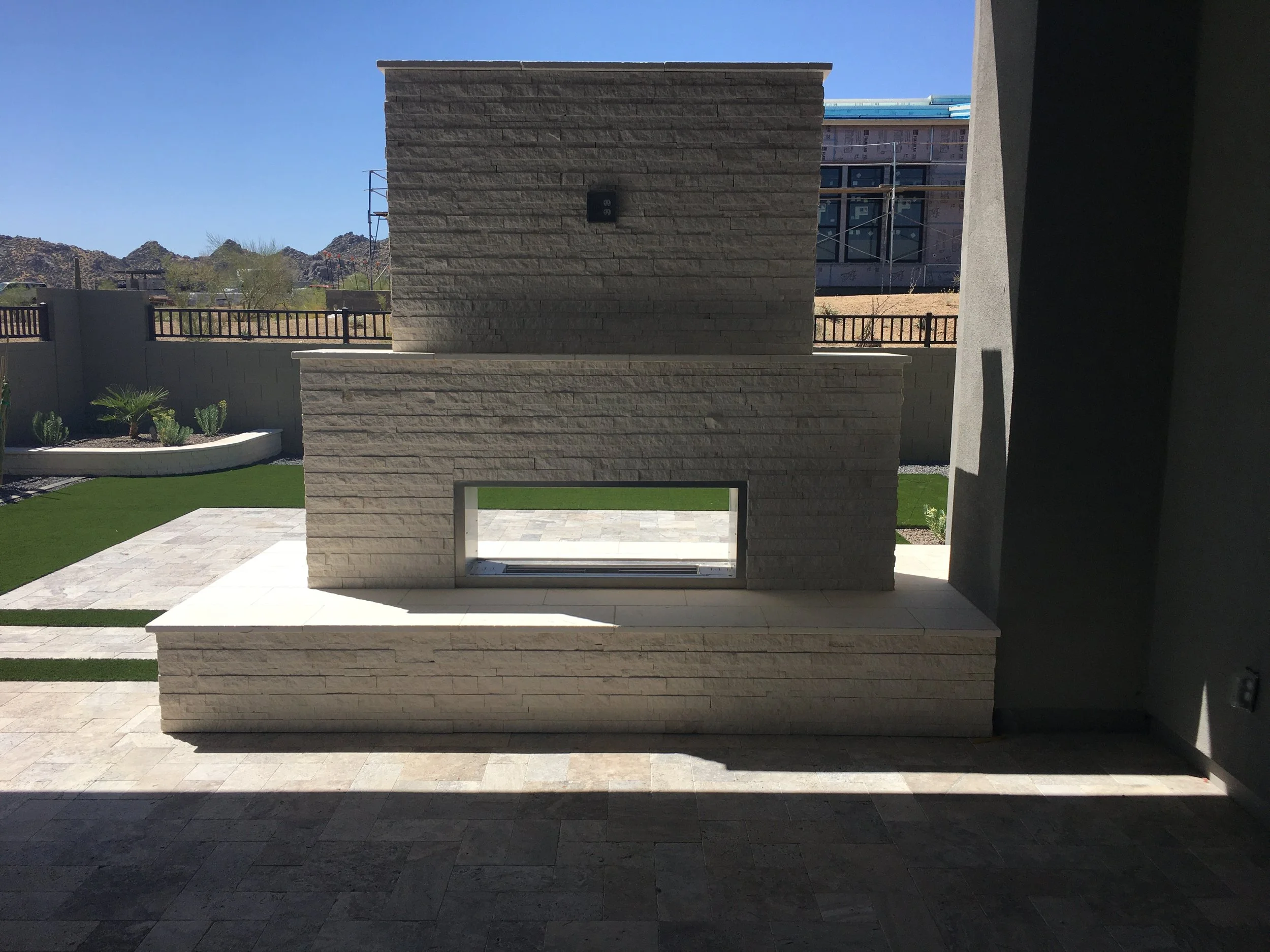 outdoor fireplace tv wall white stacked stone