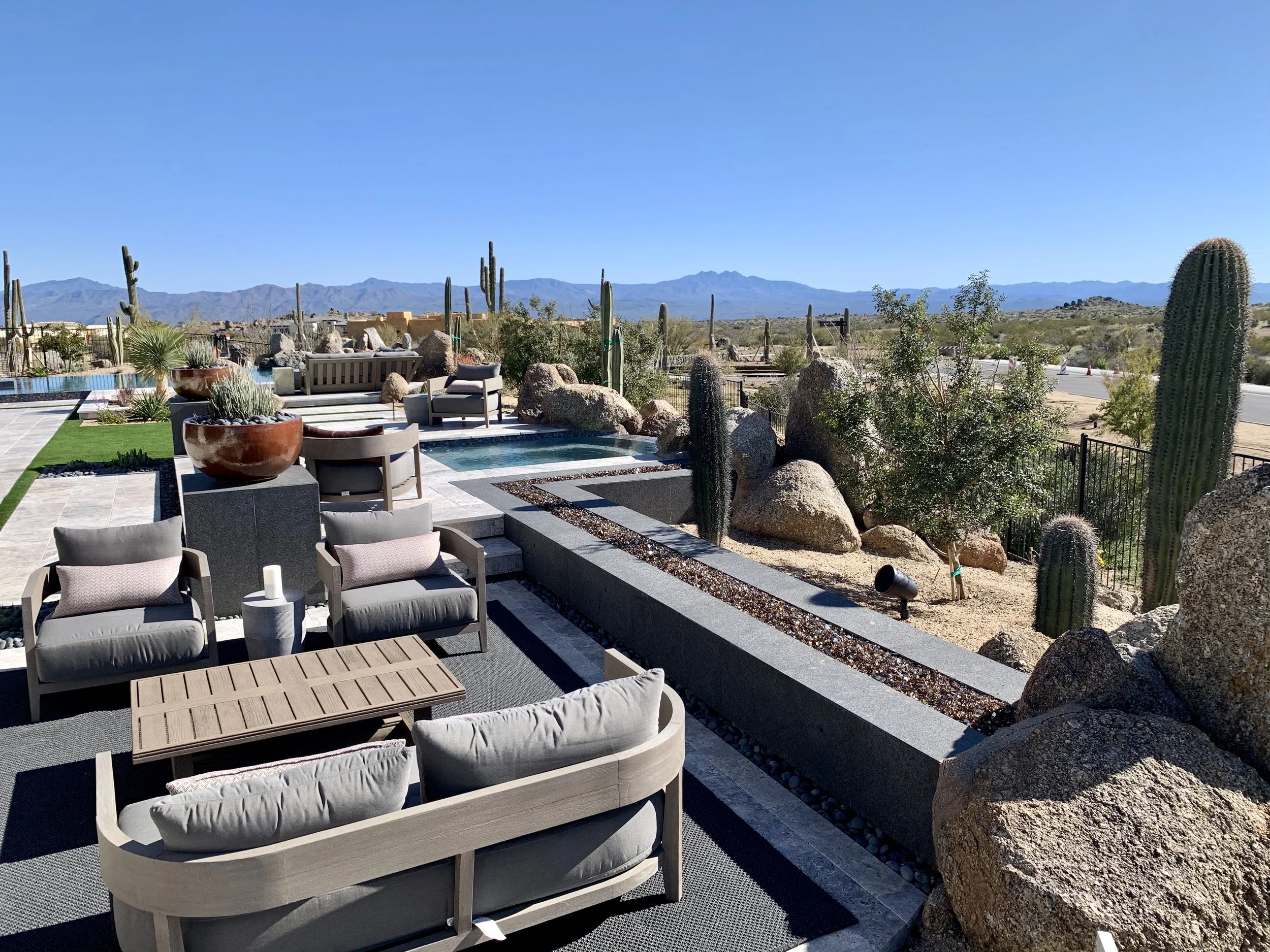 long modern firepit fire feature fire rock spa seating area cacti