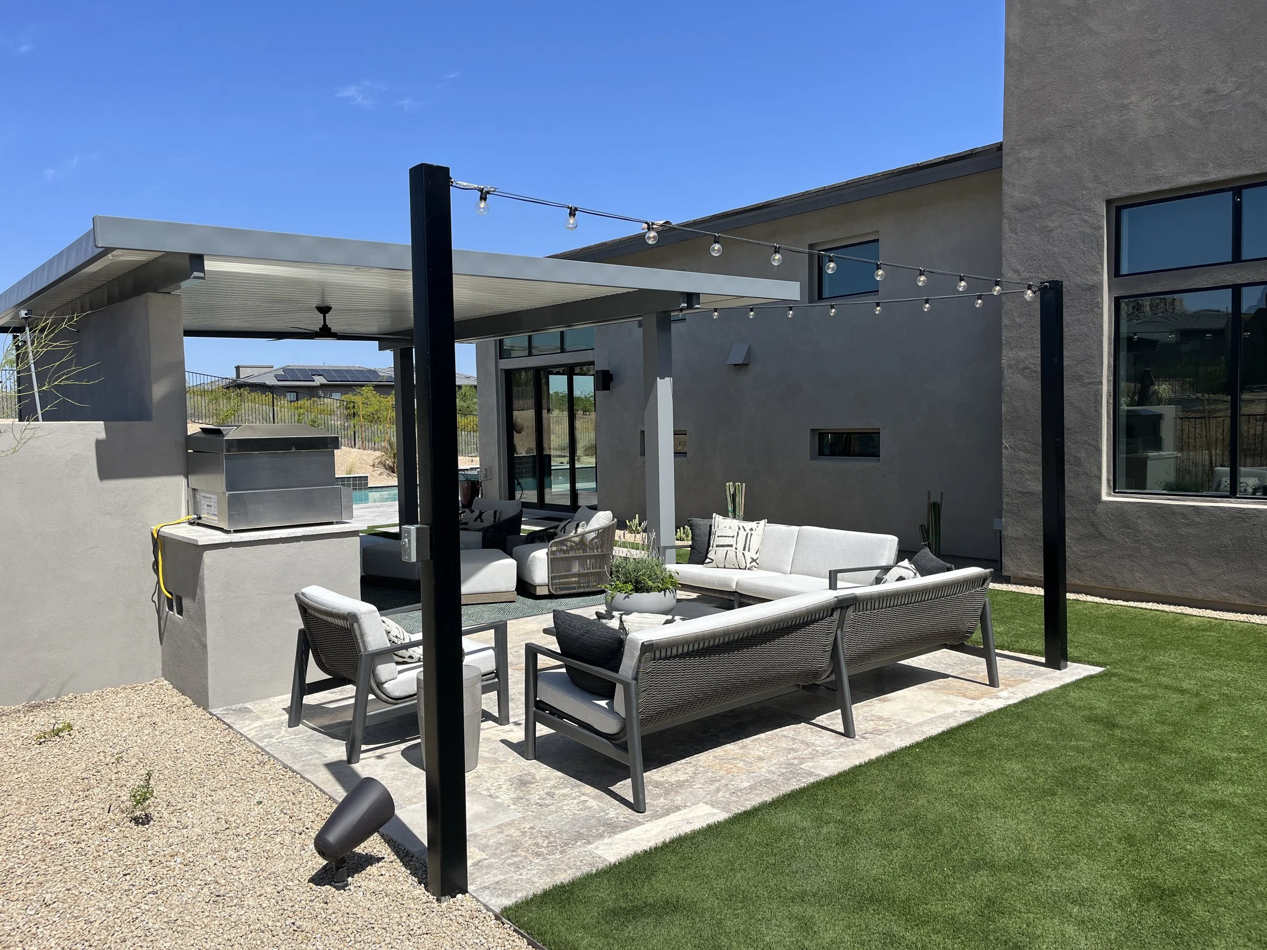 shaded ramada fan seating area entertainig outdoor dining cafe lights