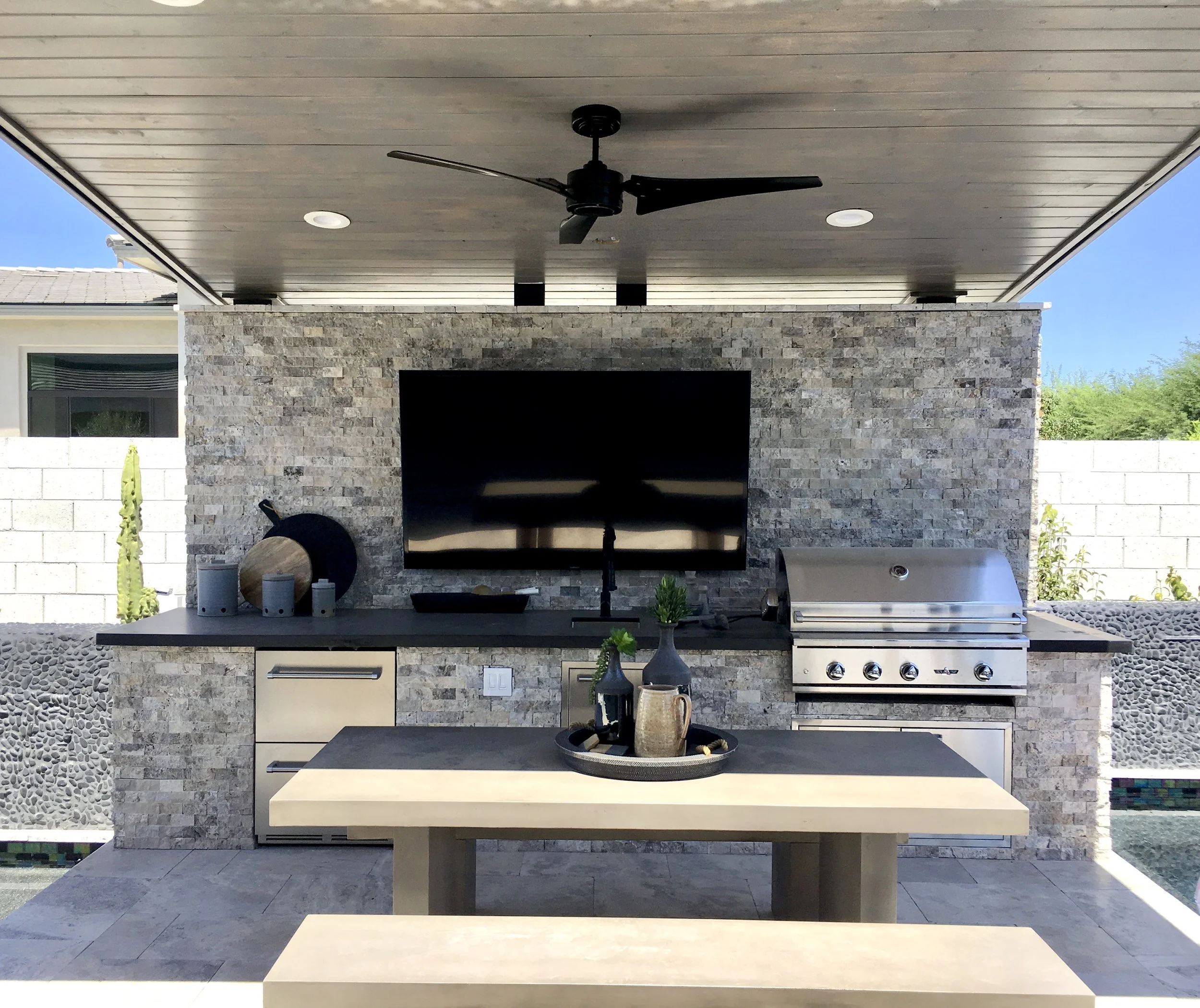 outdoor dining picnic table tv wall ramada fan grill