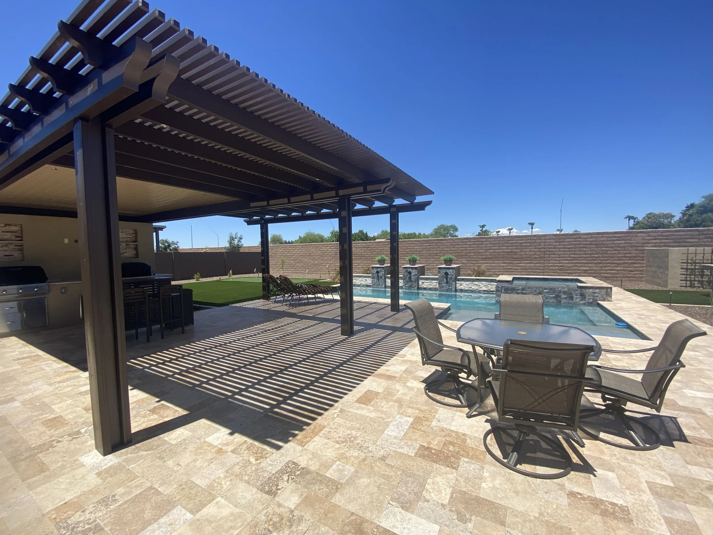 slatted ramada grill outdoor kitchen dining area pool spa