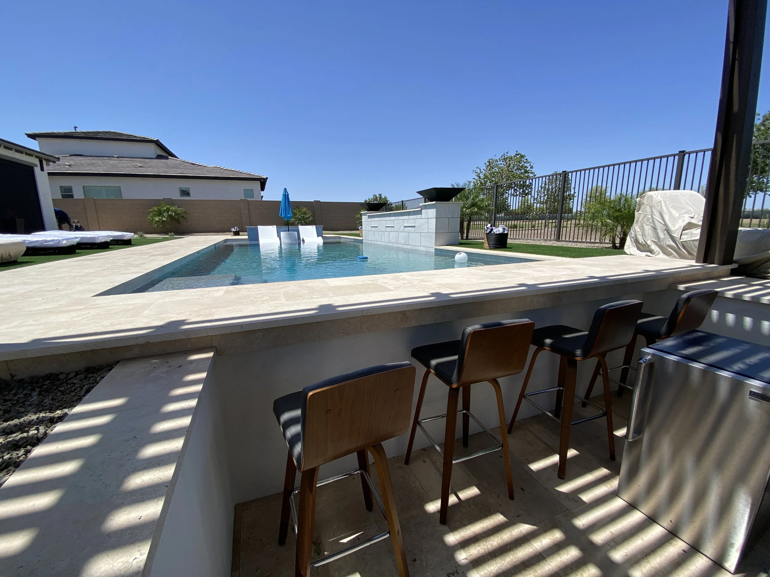 swim up sunken bar pool water feature beverage fridge