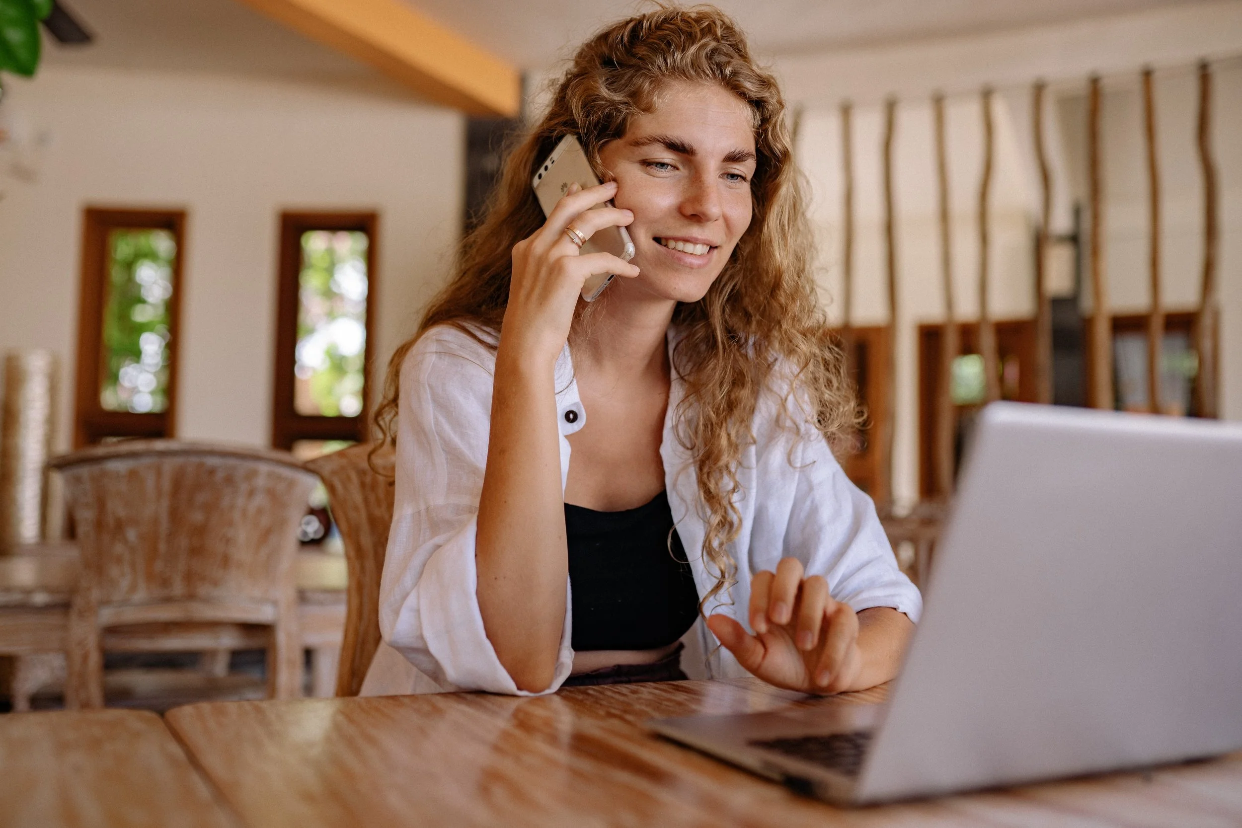 Woman with curly hair on the cell phone in a therapy session
