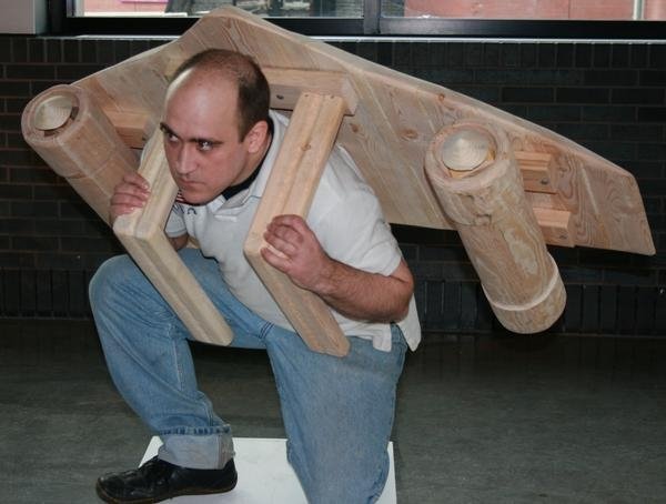 Wooden jet pack, part of sculptural performance where the artist was part of the art.